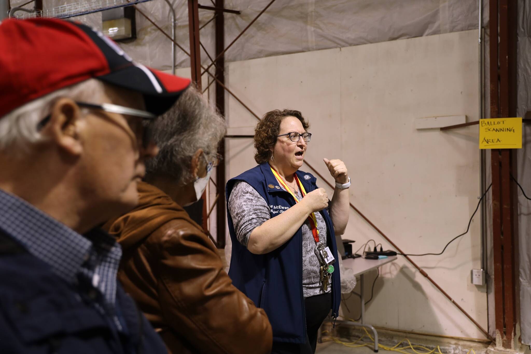 City Borough of Juneau’s City Clerk Beth McEwen gives a tour of the new local Ballot Processing Center to residents on Monday afternoon. (Clarise Larson / Juneau Empire)