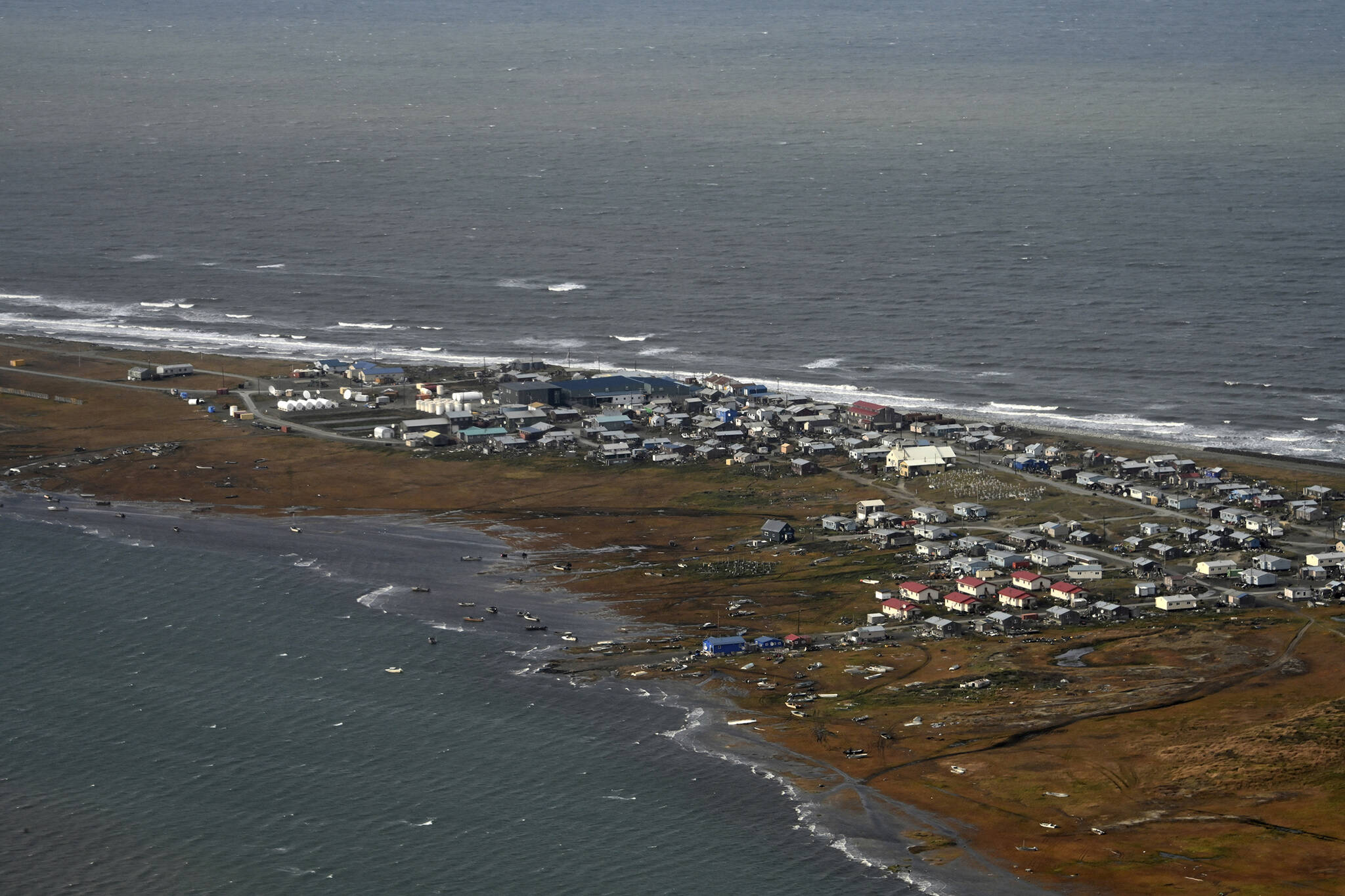In this image provided by the U.S. Coast Guard, an aerial view taken during a search and rescue and damage assessment in Deering, Alaska, shows the damage caused by Typhoon Merbok, on Sept. 18, 2022. Authorities are making contact with some of the most remote villages in the United States to determine the need for food and water and assess damage from a massive weekend storm that flooded communities dotting Alaska’s vast western coast. (Petty Officer 3rd Class Ian Gray/U.S. Coast Guard via AP)