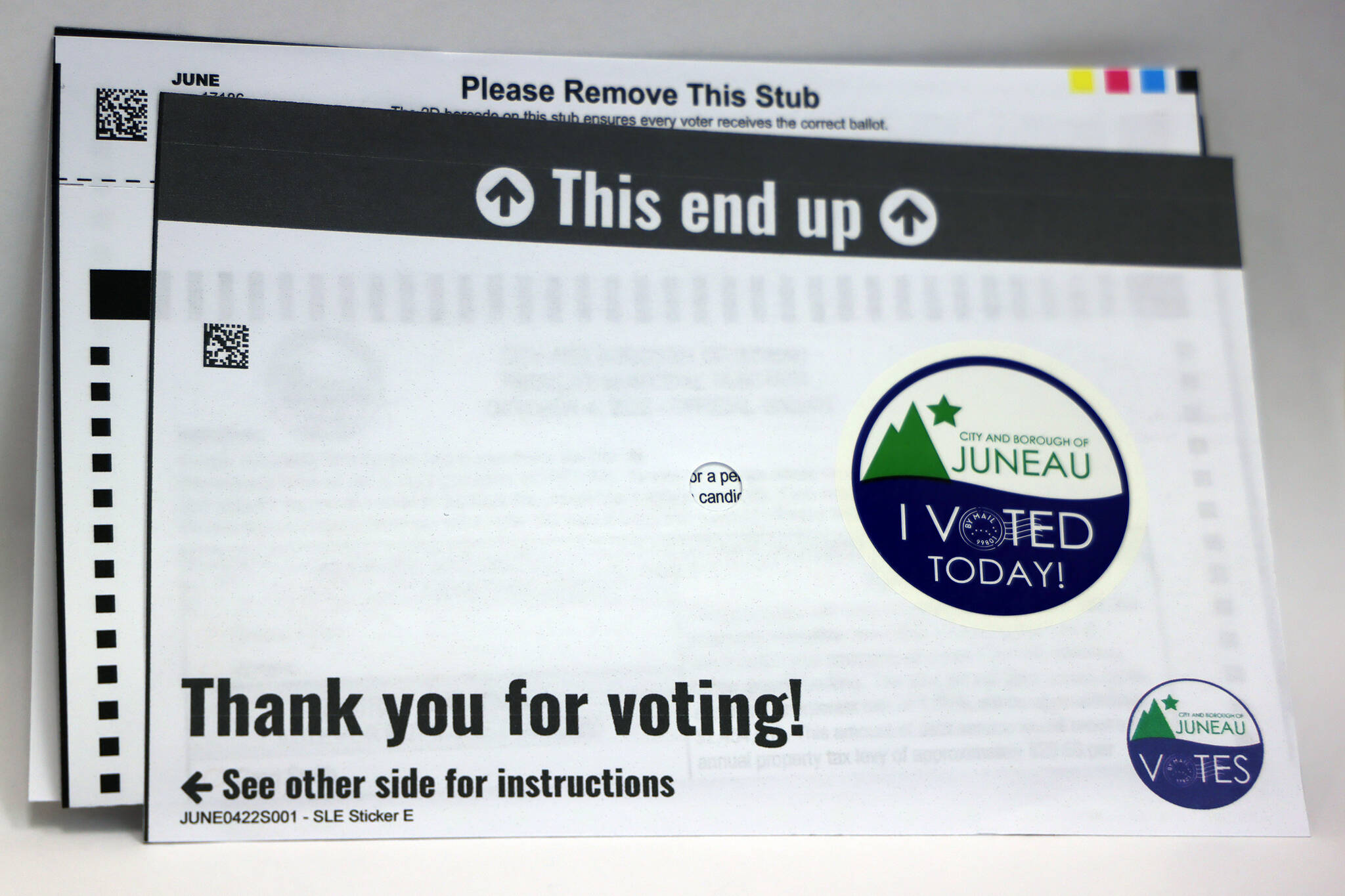 A City and Borough of Juneau Municipal Election ballot sits in a privacy sleeve. (Ben Hohenstatt / Juneau Empire)