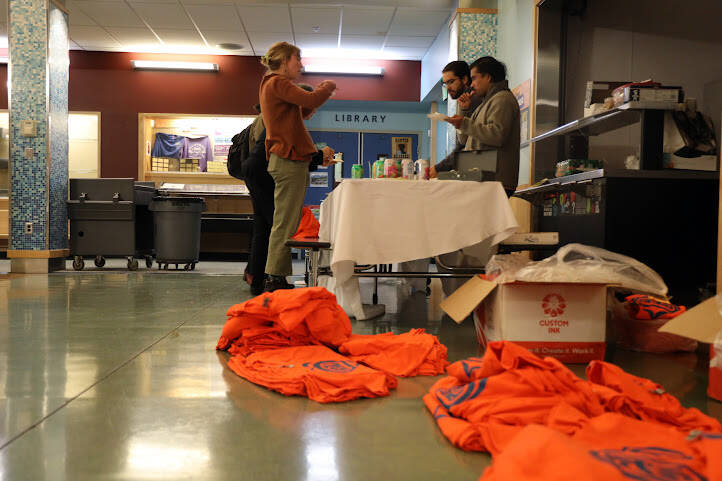 Orange shirts scatter the floor of Sayéik: Gastineau Community School Wednesday evening. Orange Shirt Day is a day dedicated to honoring survivors and families of the Indigenous boarding school system and commemorating the children who didn’t return home. (Clarise Larson / Juneau Empire)
