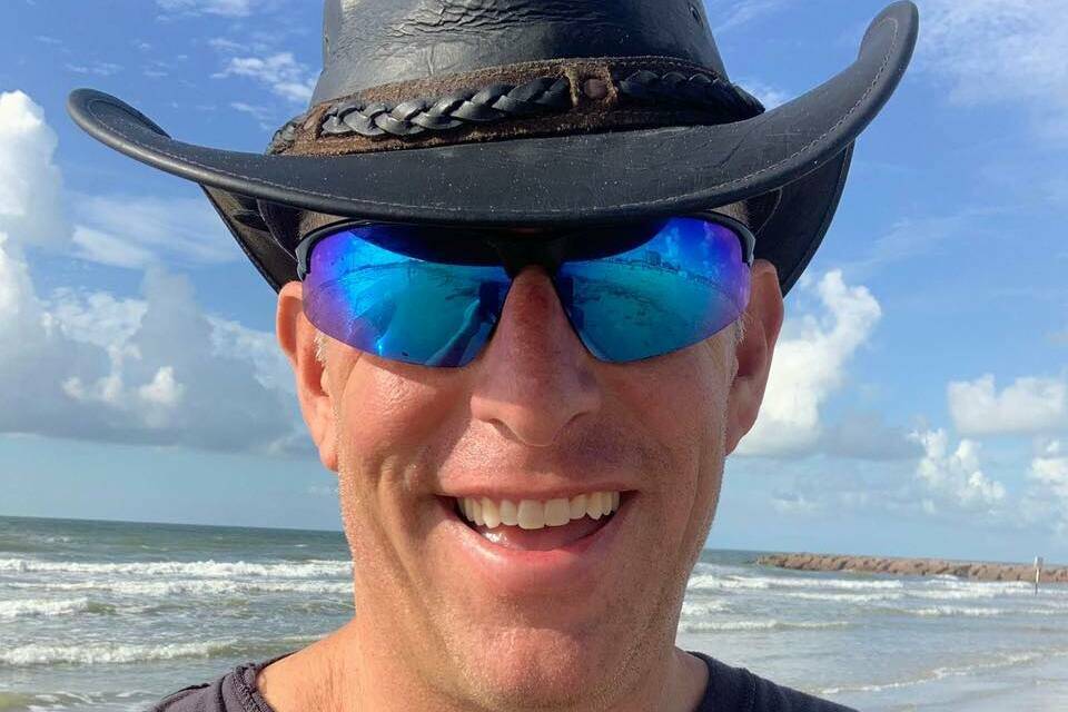 “Hurricane Hal” Needham smiles on a benign day on a Galveston, Texas, beach. The extreme weather and disaster scientist for CNC Catastrophe & National Claims recently drove to a parking garage in southwest Florida to document Hurricane Ian. (Courtesy Photo / Hal Needham)