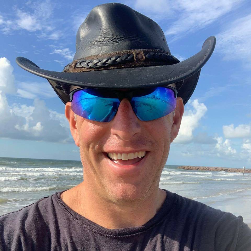 “Hurricane Hal” Needham smiles on a benign day on a Galveston, Texas, beach. The extreme weather and disaster scientist for CNC Catastrophe & National Claims recently drove to a parking garage in southwest Florida to document Hurricane Ian. (Courtesy Photo / Hal Needham)