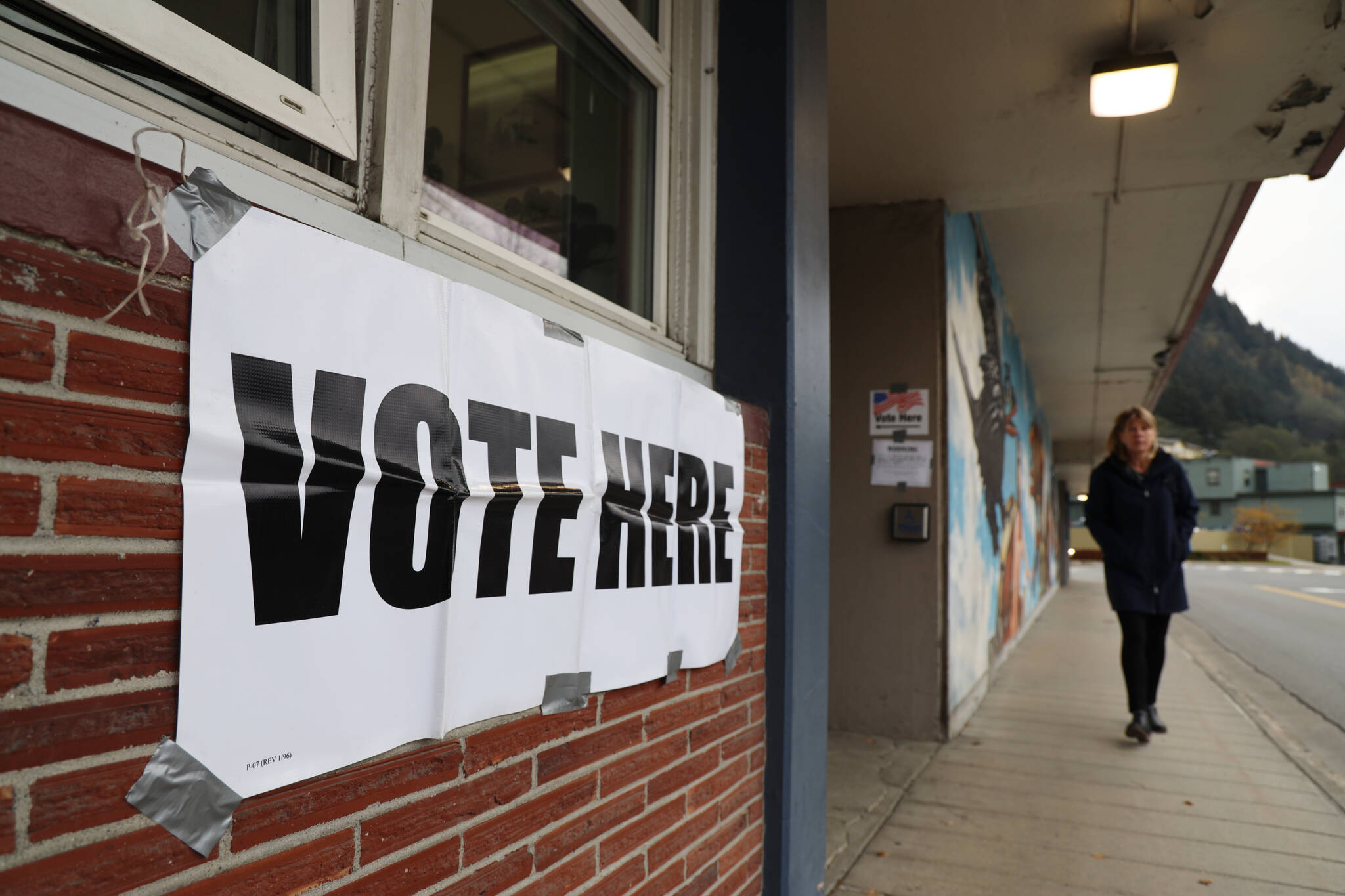 Clarise Larson / Juneau Empire 
A sign to guide voters to the City Hall Assembly Chambers voter center hangs duct taped to the outside wall of the building on Election day Tuesday morning. Tuesday was the last day for residents to cast their votes before polls close at 8 p.m.