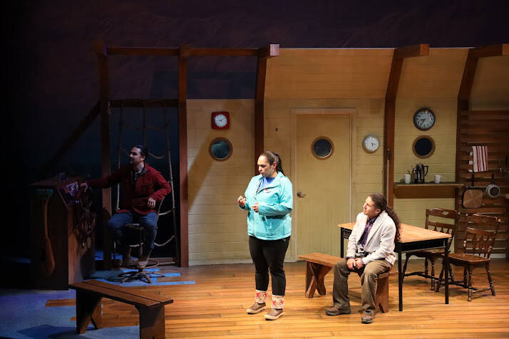 From left to right, actors Jake Waid (John), Xáalnook Erin Tripp (Rose) and Kenny Ramos (Anthony) share the stage as a scene shifts from one conversation to another. “Where the Summit Meets the Stars” is driven by music, dance and the culture of the Tlingit people and is the 44th season opener for Perseverance Threatre. (Clarise Larson / Juneau Empire)