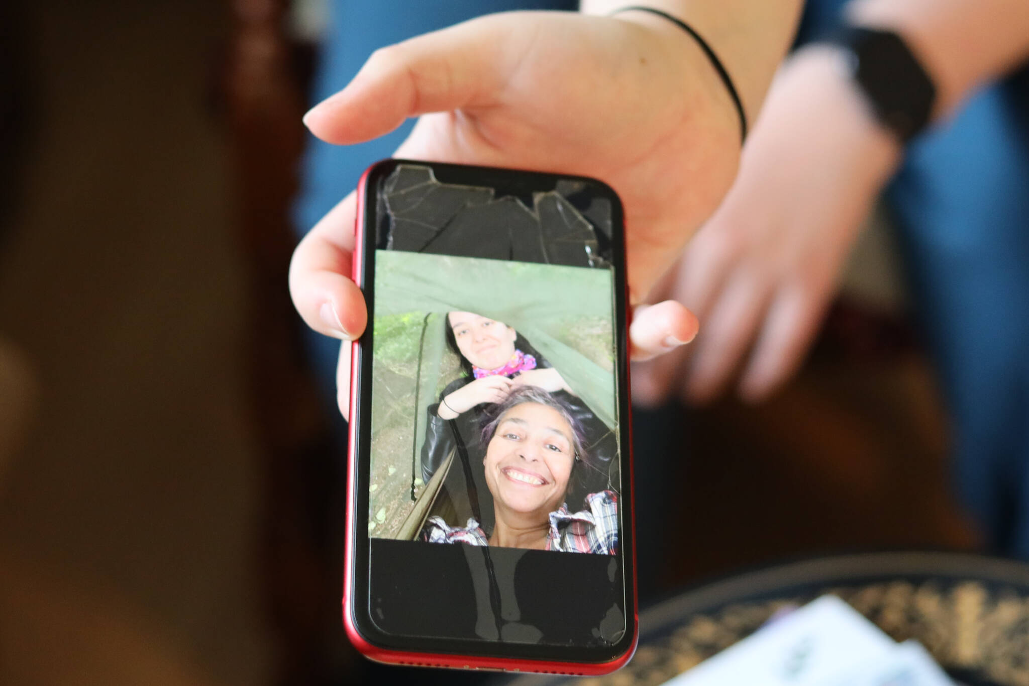 Clarise Larson/ Juneau Empire
Harmony Wentz, Faith Rogers’ daughter, holds out her phone to show a photo of the pair sharing a hammock. According to Juneau Police Department spokesperson Erann Kalwara, authorities are working to identify a suspect responsible for Rogers’ death.