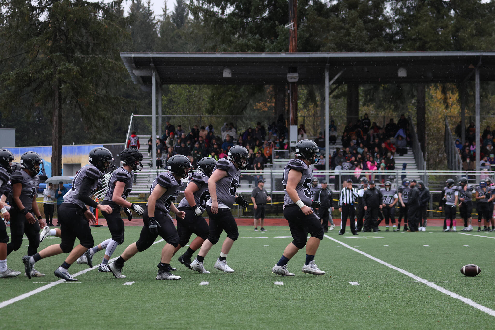 Juneau’s offense breaks the huddle and heads toward the ball during a lopsided playoff win against South Anchorage. (Ben Hohenstatt / Juneau Empire)