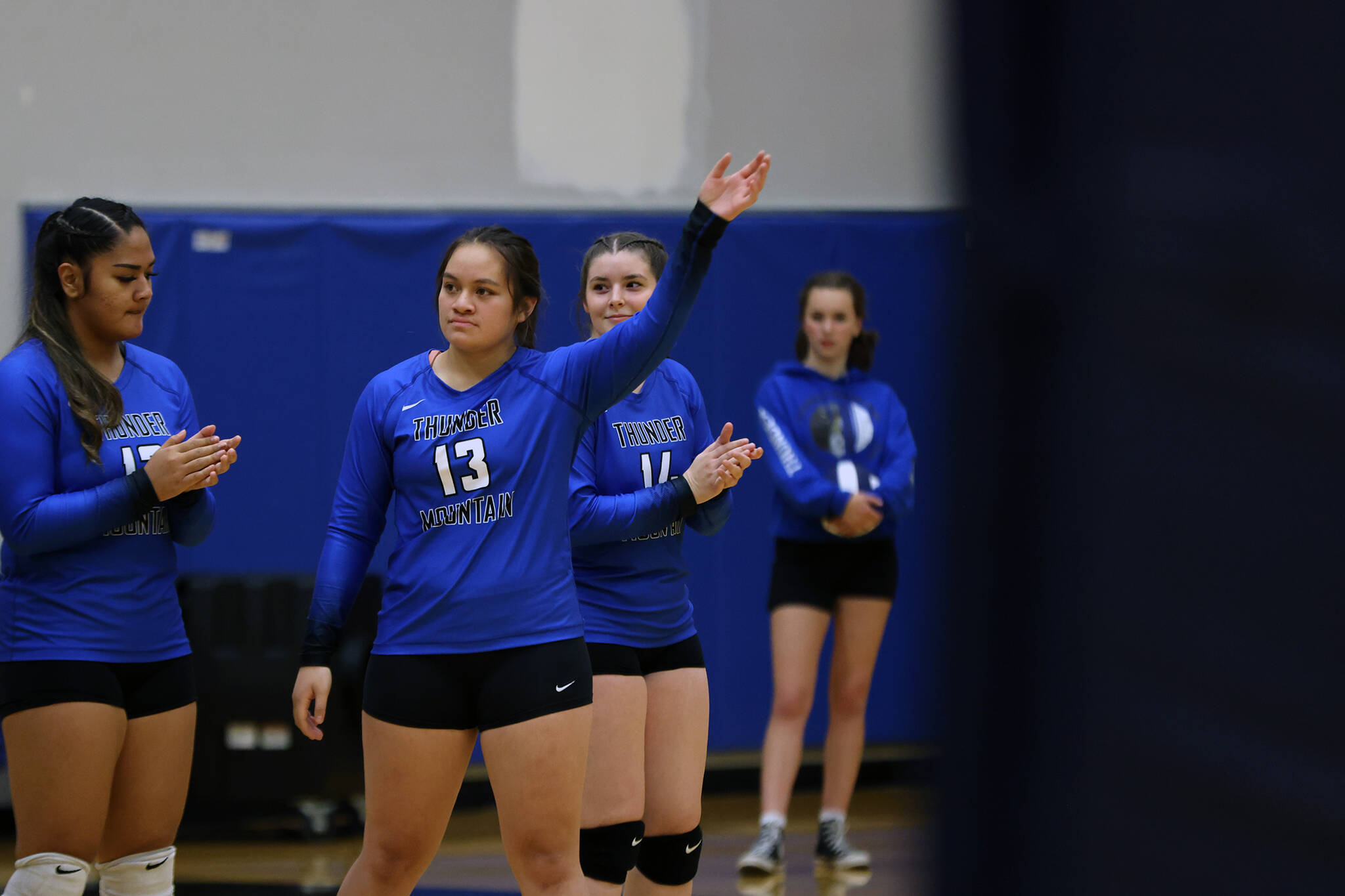 Senior Talita Toutailepo waves to the crowd during introductions before the team’s first match up against the Ketchikan Lady Kings back in early Sept. Over the weekend Toutailepo came up big in THMS’ second face off against the Lady Kings. (Ben Hohenstatt / Juneau Empire File)