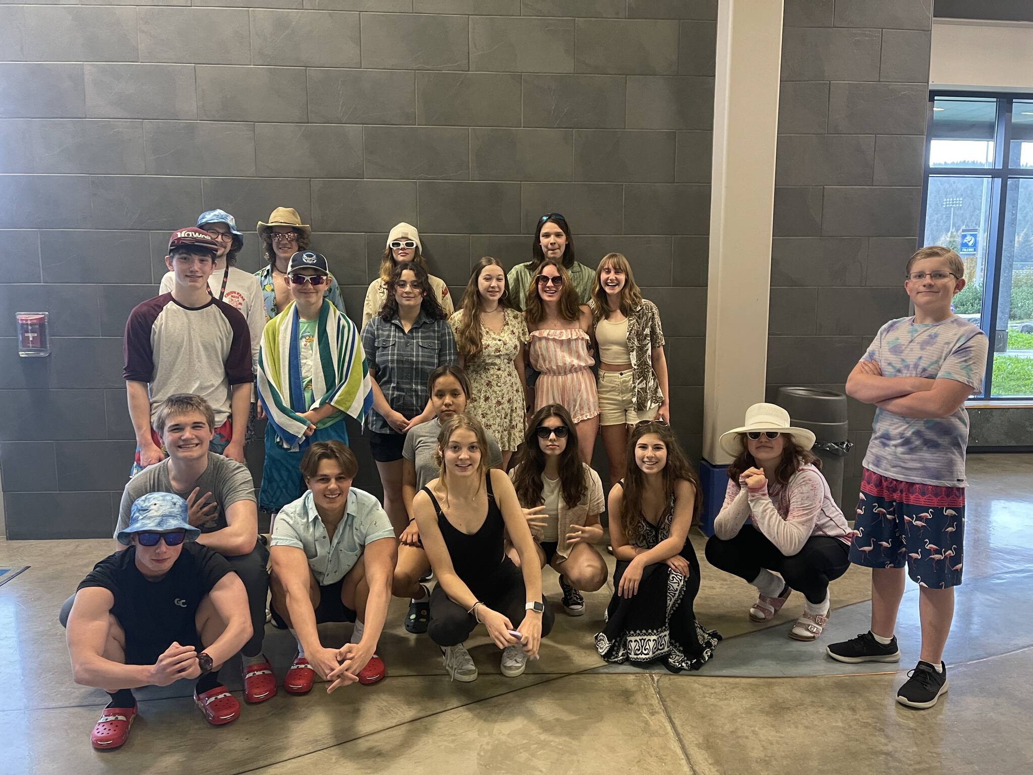 THMS swim team featured in this photo in beach attire to show team spirit before their meet in Petersburg on Sept. 30 and Oct. 1. Regions begin on Oct. 28 in Juneau Dimond Park Aquatic Center. (Courtesy Photo / Josiah Loseby)