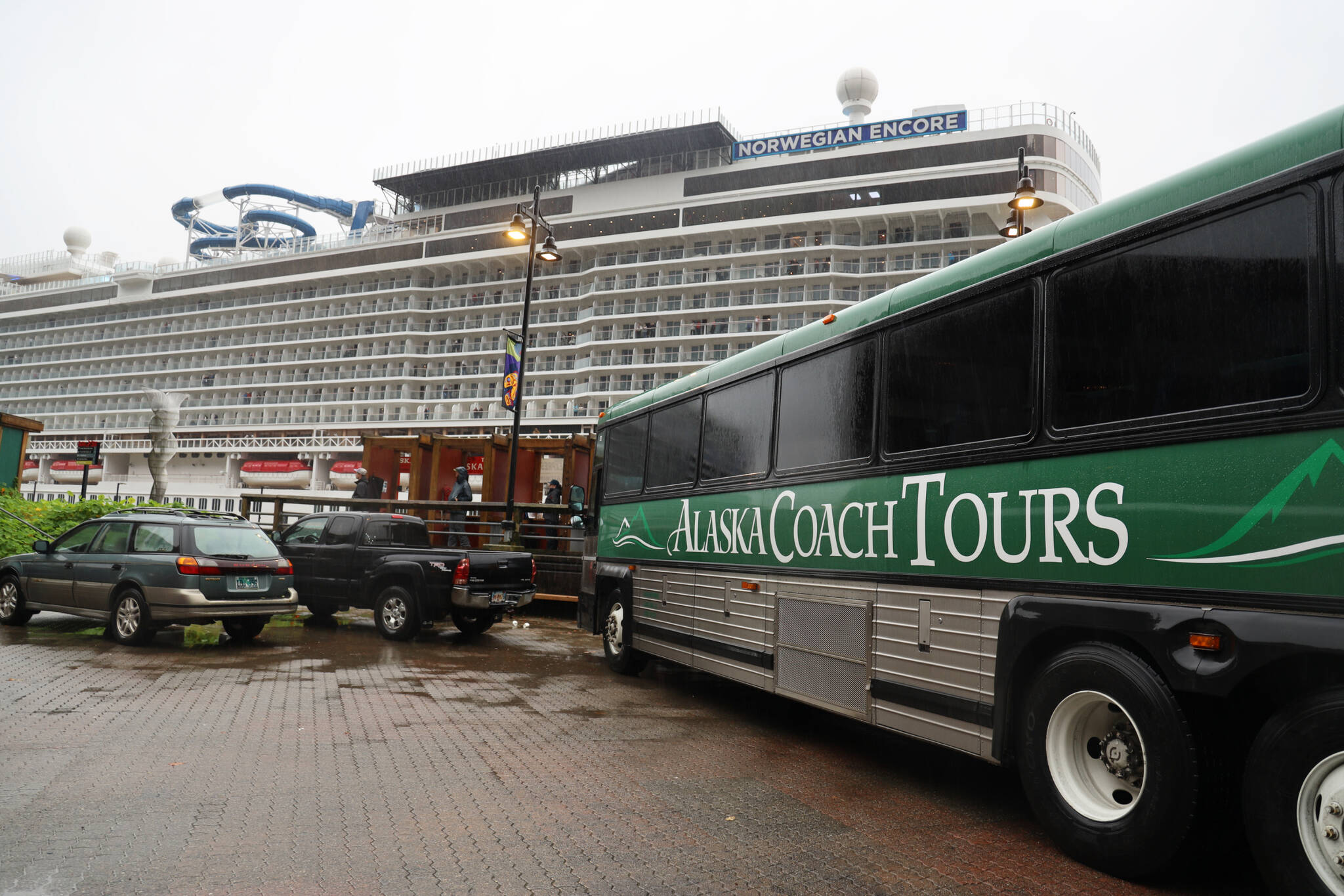An Alaska Coach Tours bus sits parked beside the cruise ship dock in downtown Juneau. Alexandra Pierce, the CBJ tourism manager, said this year’s season went “relatively smoothly” and said the revival of tourism was overall well received by the residents and downtown businesses. (Clarise Larson / Juneau Empire)