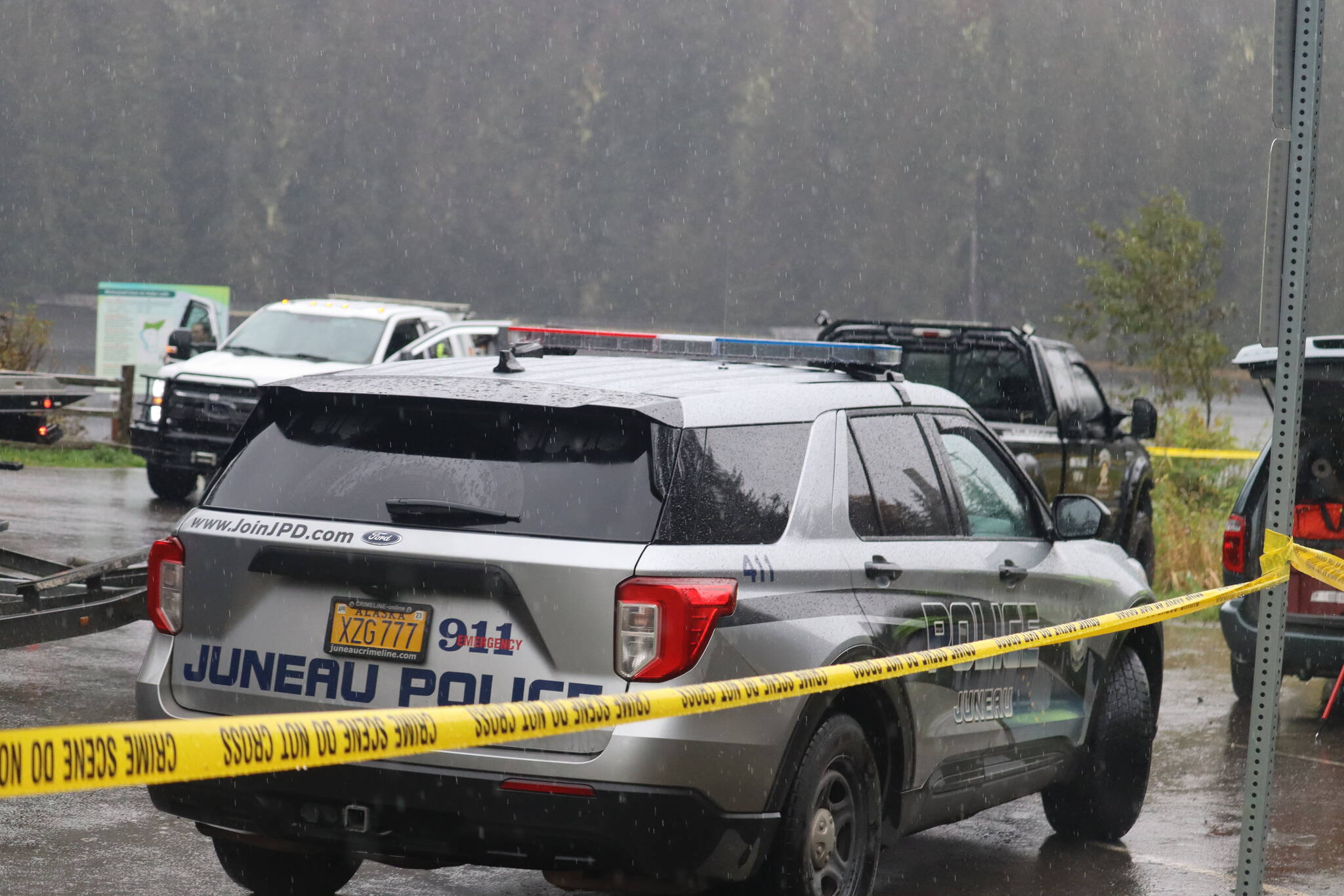 JPD officers investigate at Auke Lake after a deadly crash early Tuesday morning, Oct. 18. (Jonson Kuhn / Juneau Empire)