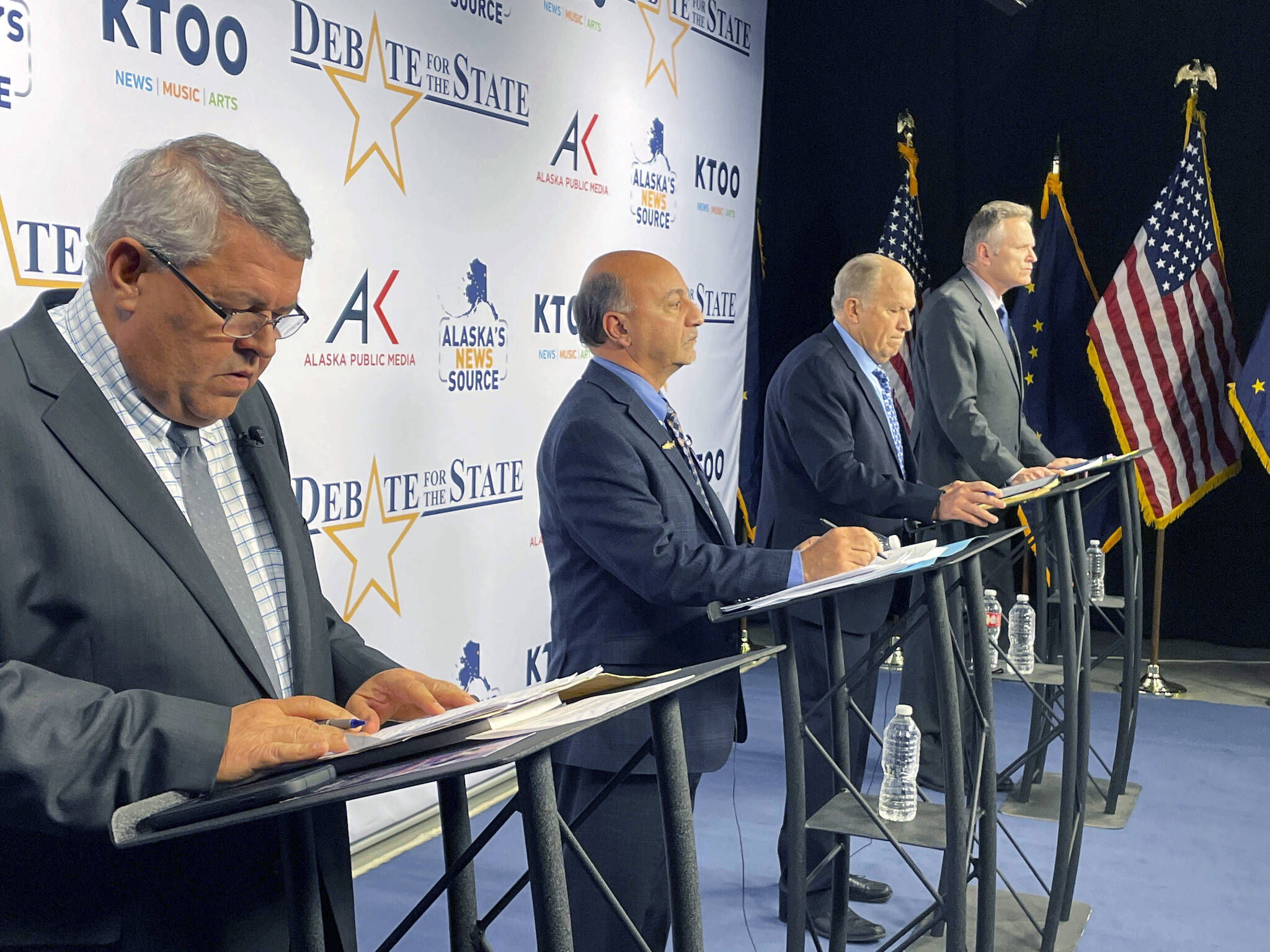AP Photo / Mark Thiessen
The four candidates for Alaska governor are shown preparing for a televised debate Wednesday in Anchorage. From left are Republican Charlie Pierce; Democrat Les Gara; former Gov. Bill Walker, an independent; and Gov. Mike Dunleavy, a Republican.