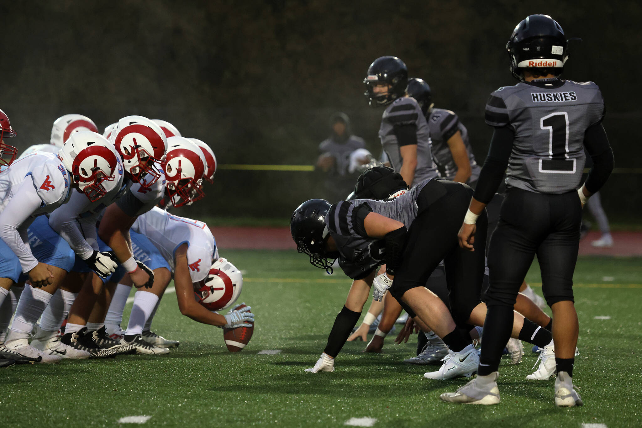 Juneau’s defense lines up against the visiting West Valley High School Rams from Washington state. The Huskies prevailed in their lone out-of-conference match-up.
