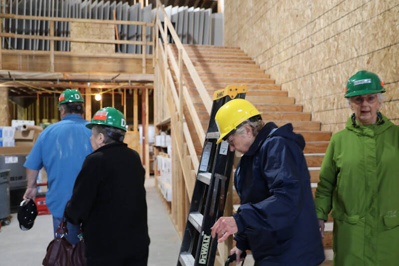 A group of Juneau residents tour the Riverview Senior Living facility which is currently under construction and slated to open in early to mid-2023, according to the company. (Clarise Larson / Juneau Empire)