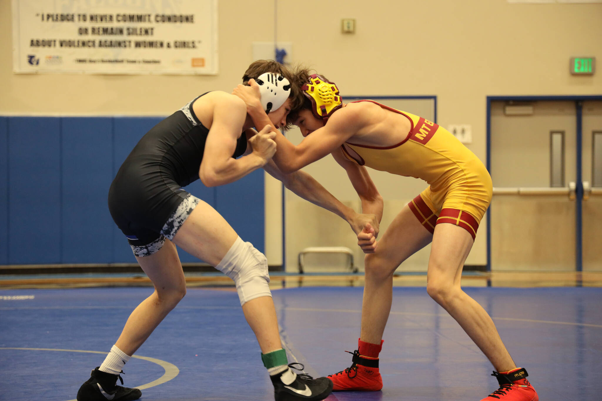 Thunder Mountain High School wrestler Carson Cummins goes head to head with his competition Saturday afternoon during the Brandon Pilot Invitational Wrestling Tournament at THMS. At 119 lbs. senior, Cummins took first going 7-0 for the weekend. (Clarise Larson / Juneau Empire)
