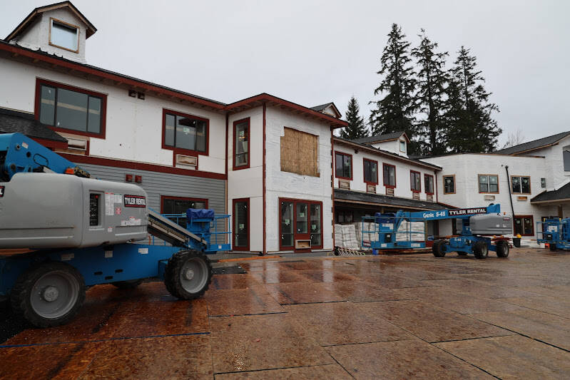 A patters down on construction equipment scattered in the parking lot of the Riverview Senior Living, which is currently under construction and slated to open in early to mid-2023, according to the company. (Clarise Larson / Juneau Empire)