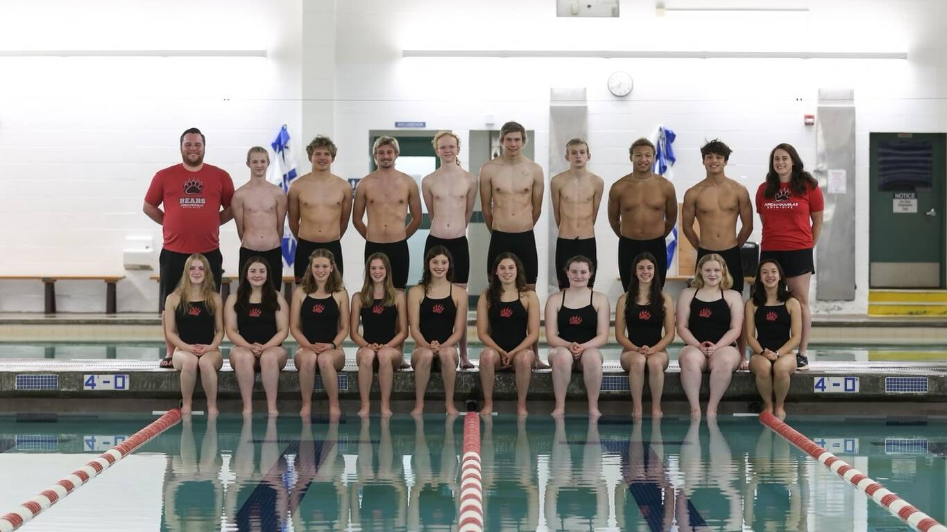JDHS swim team featured in this photo from left to right and starting in the back row, Coach Seth Cayce, Cole Reel, Chris Degener, Chaz VanSlyke, Elyas Taylor, Harrison Holt, Owen Rumsey, Aaron Mulgrew-Truitt, Matthew Plang, Coach Amber Kelly, (Front Row) MIkayla Neal, EMily Delgado, Pacific Ricke, Valerie Peimann, Emma Fellman, Samantha Schwarting, Parker Boman, Anita Morrison, Brooklyn Kanouse, and Bella Reyes-Boyer. Not pictured: Kate Schwarting. (Courtesy Photo / Phil Loseby)