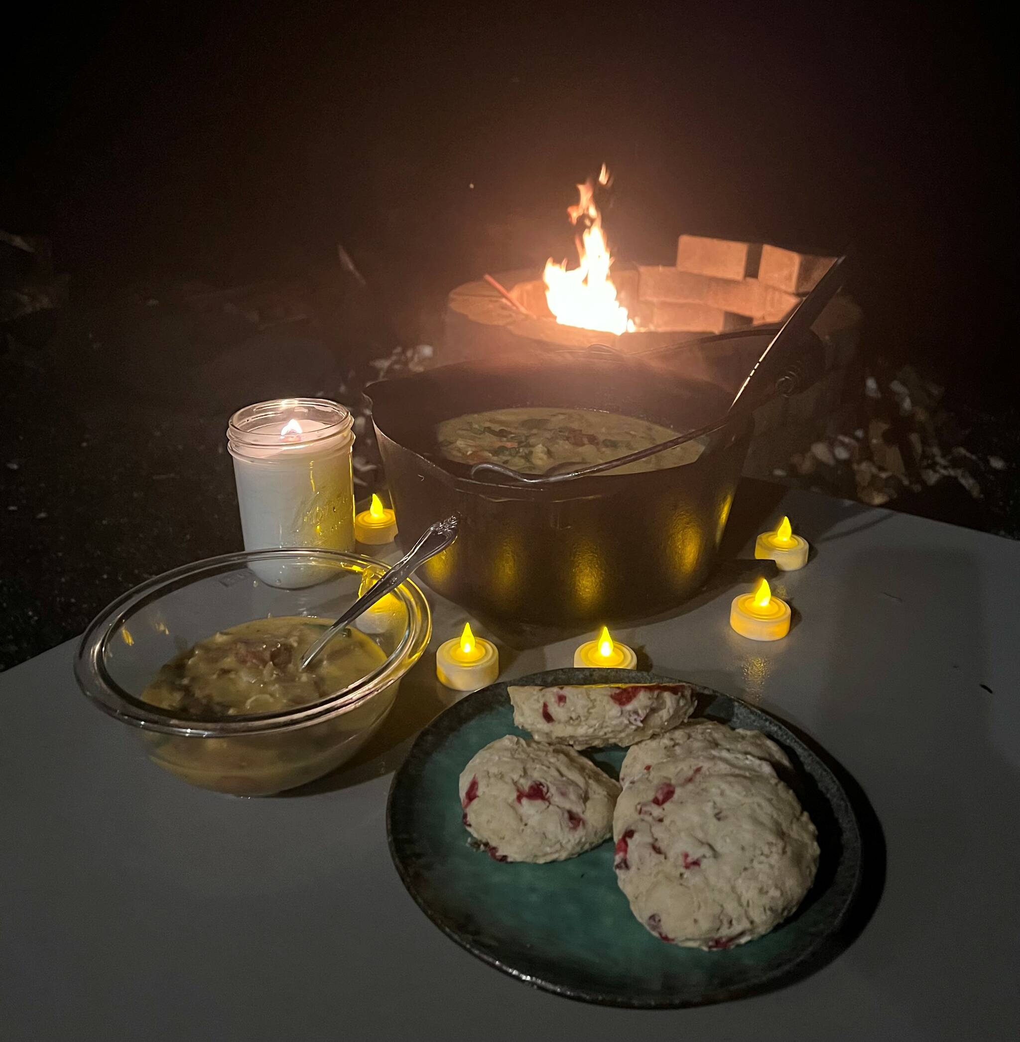 This photo shows a cauldron of halibut chowder around the firepit on a Fall evening. (Vivian Faith Prescott / For the Capital City Weekly)