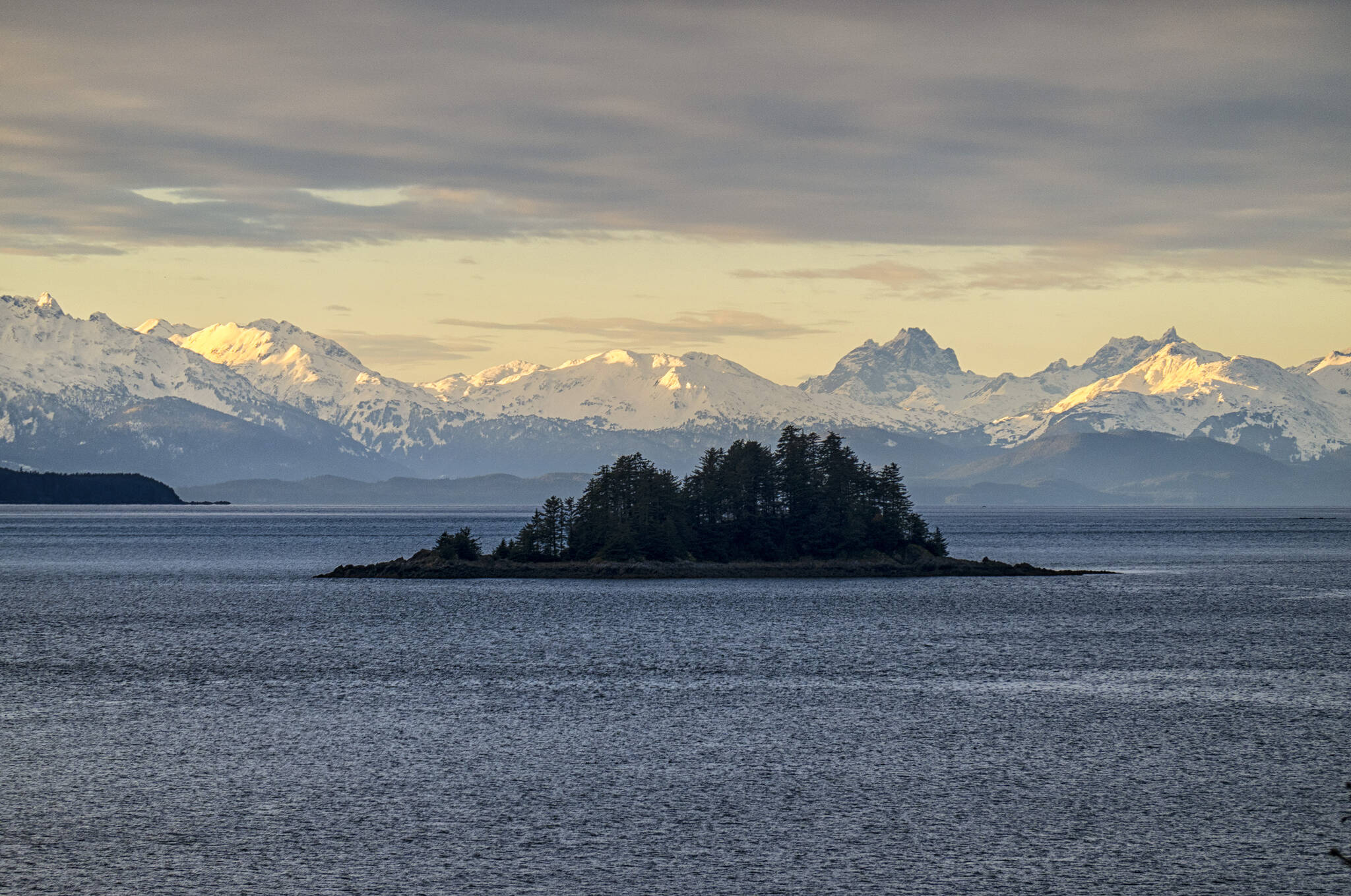 This photo shows Cohen Island with the Lynn Canal and the Chilkat Range, Southeast Alaska.(Courtesy Photo / Kenneth Gill, gillfoto)