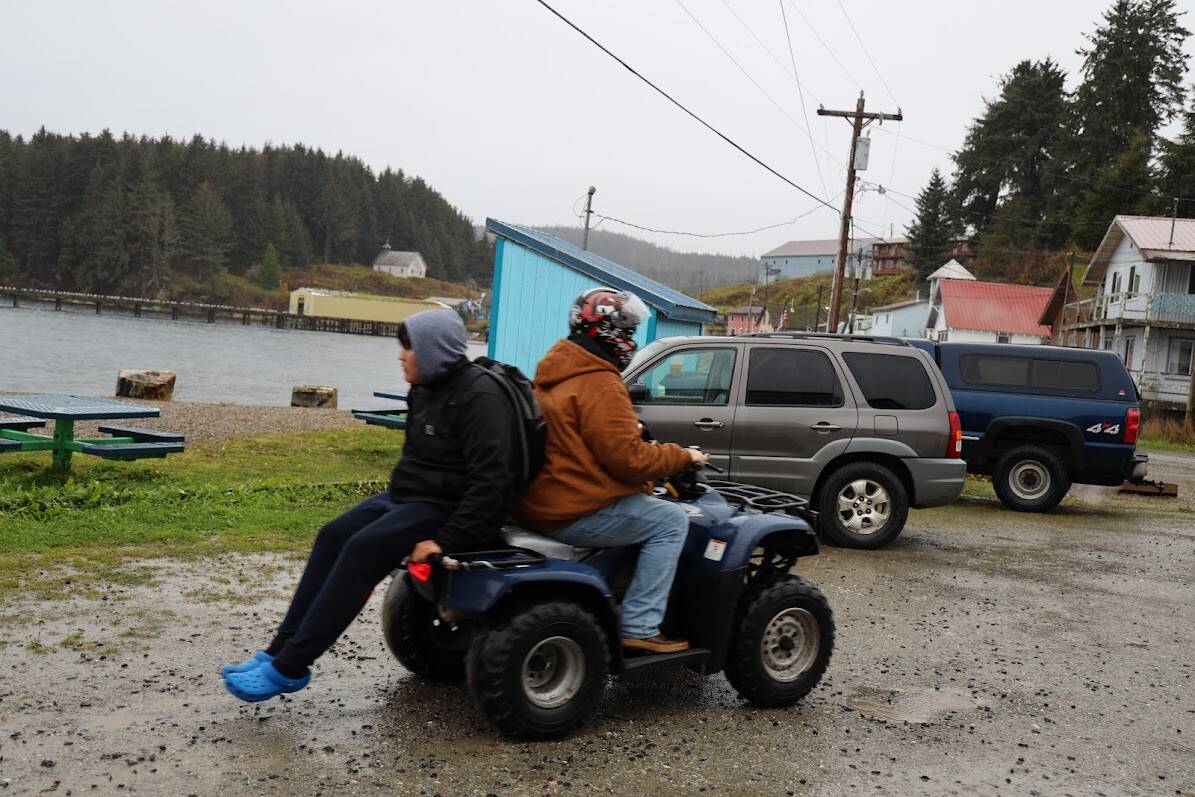 Two Chatham School District students ride their four-wheeler home from the school’s gym in late October. According to data from Feeding America, a nationwide nonprofit that works to address food insecurity, it’s estimated that 22.8% of the child population in the Hoonah-Angoon Census Area experienced food insecurity in 2019, which is 56.2% higher than the national average.(Clarise Larson / Juneau Empire)