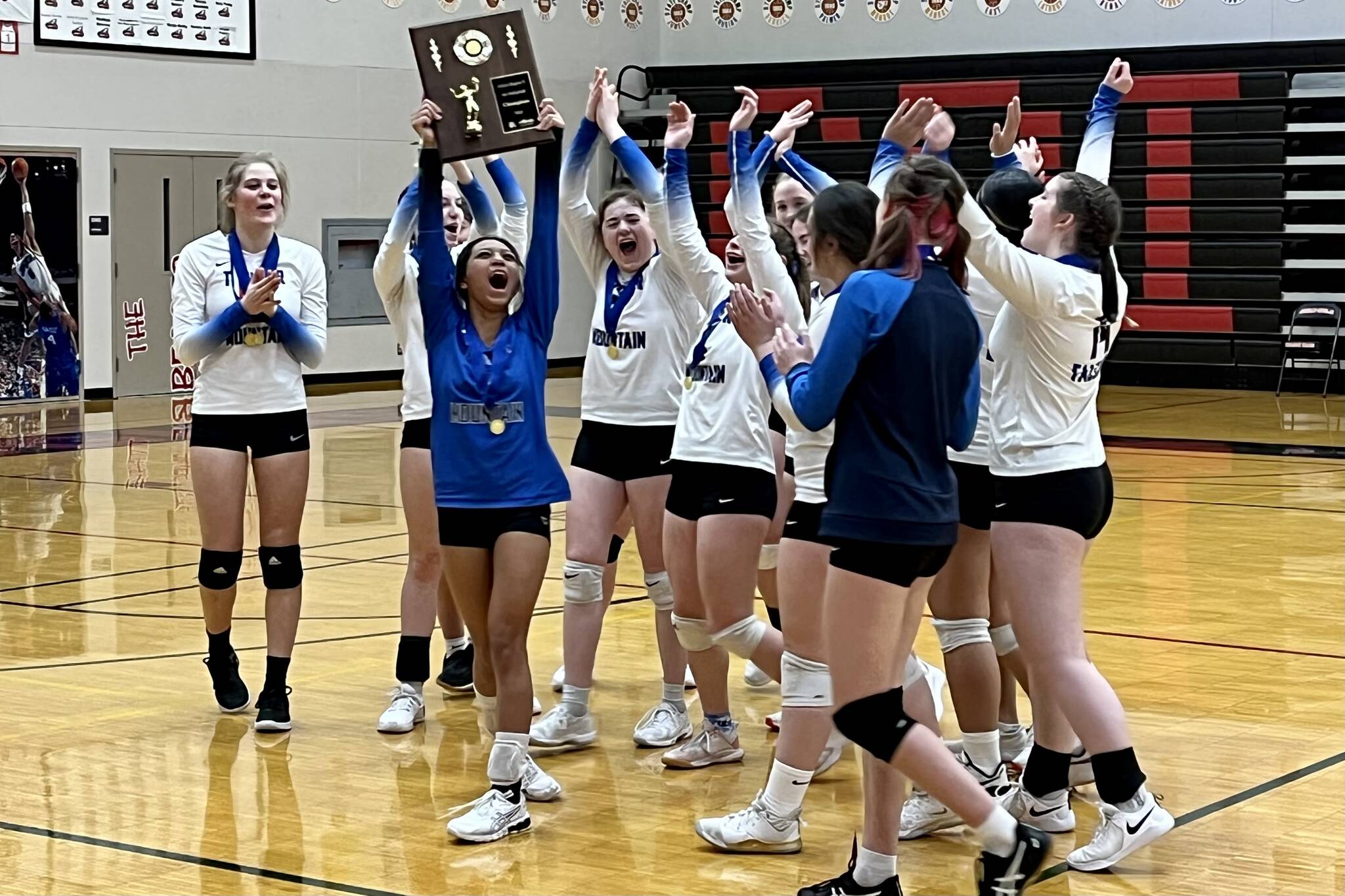 Thunder Mountain girls varsity volleyball team celebrating their championship victory against JDHS on Saturday, Nov. 5. TMHS now heads to the state tournament in Anchorage to face Colony in the first round on Thursday, Nov. 10. (Jonson Kuhn / Juneau Empire)