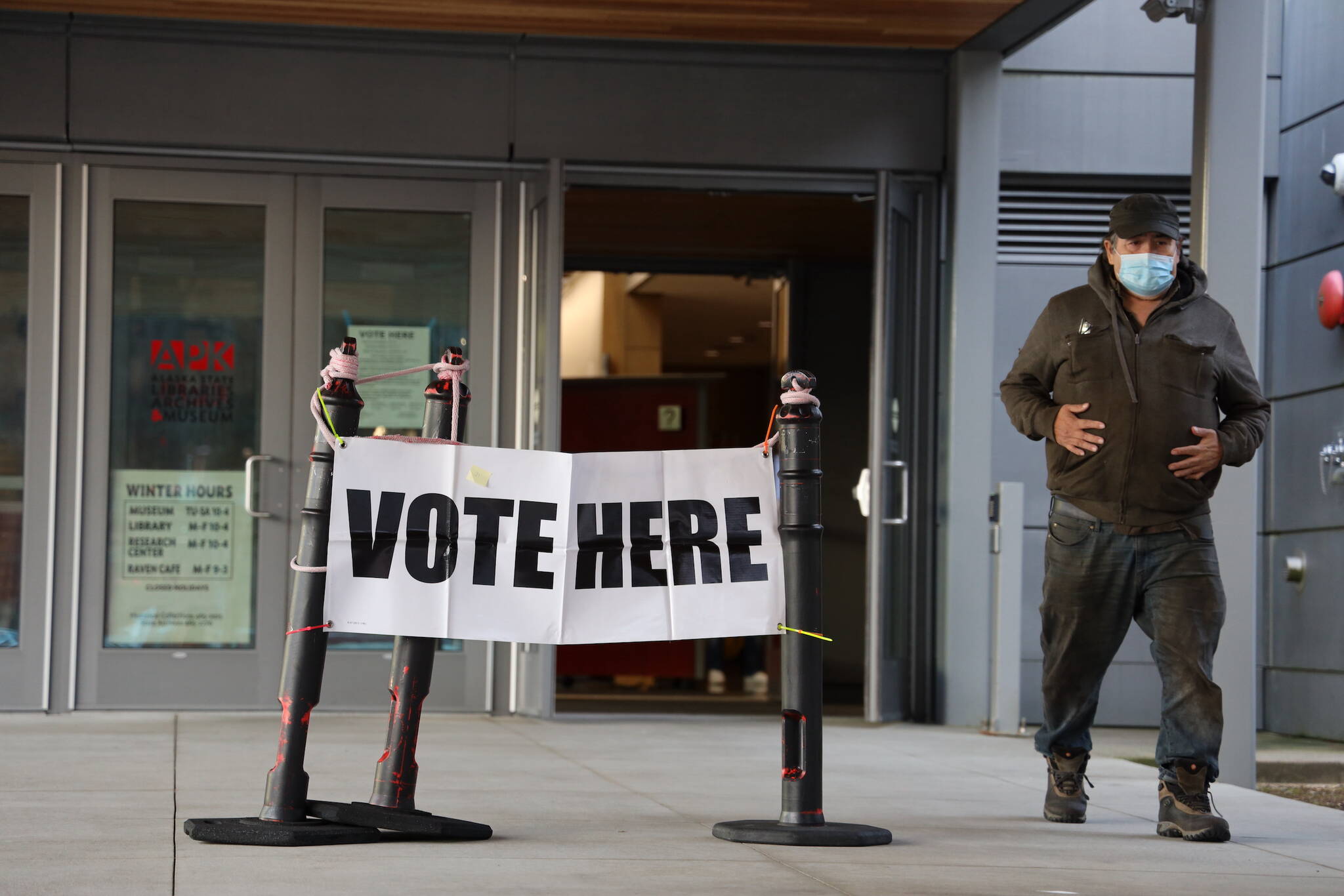 John Peterson exits the Alaska State Museum after casting his ballot in Tuesday’s general election. He said more information provided to voters make the state’s new ranked choice voting process easier than during the primary election in August. (Clarise Larson / Juneau Empire)