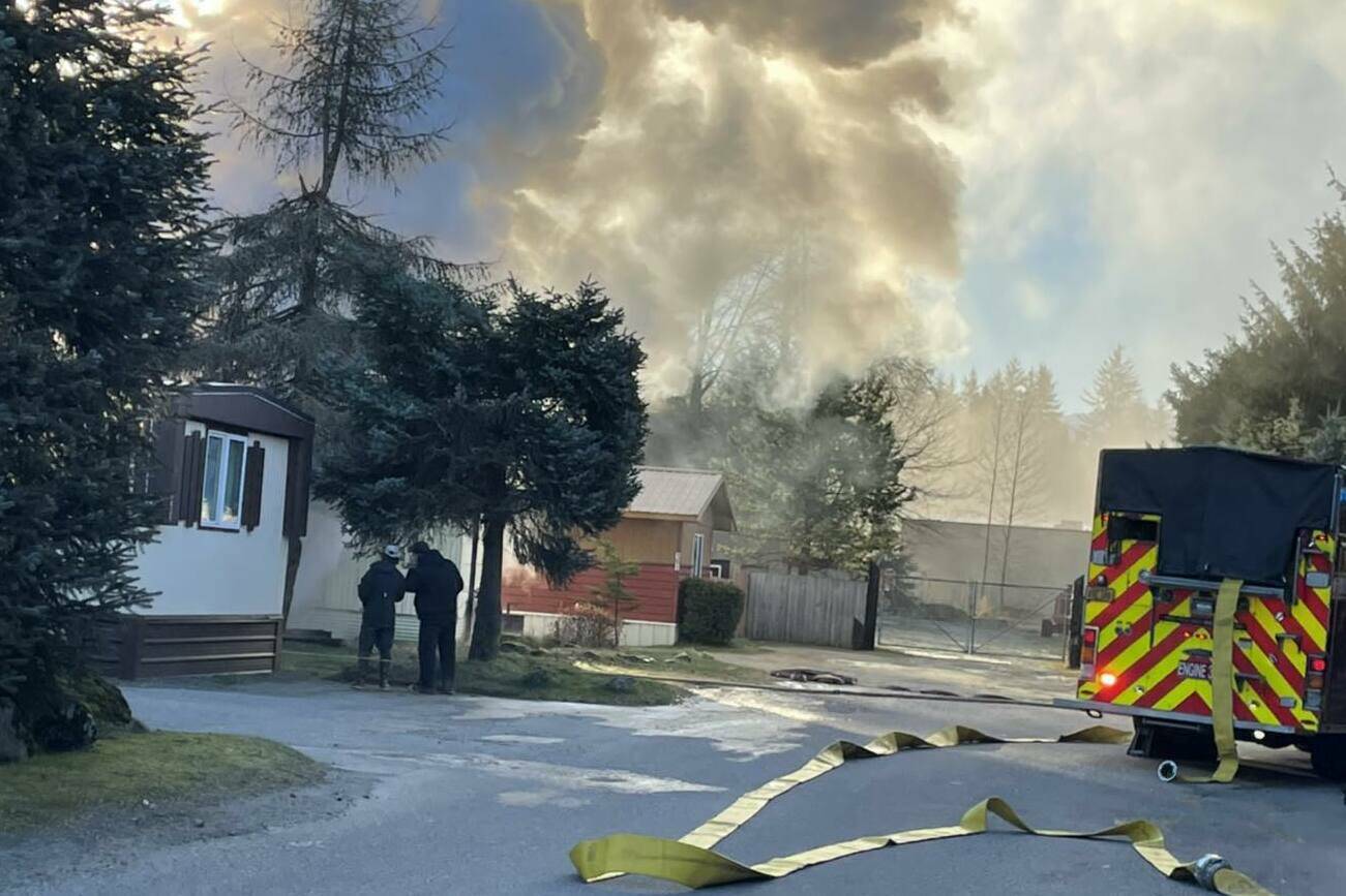 CCFR firefighters working to extinguish a fire at a mobile home in Sprucewood Park on Monday morning. One man was reported to have escaped the fire with minor injuries and was taken to Bartlett Regional Hospital. (Courtesy Photo / CCFR)