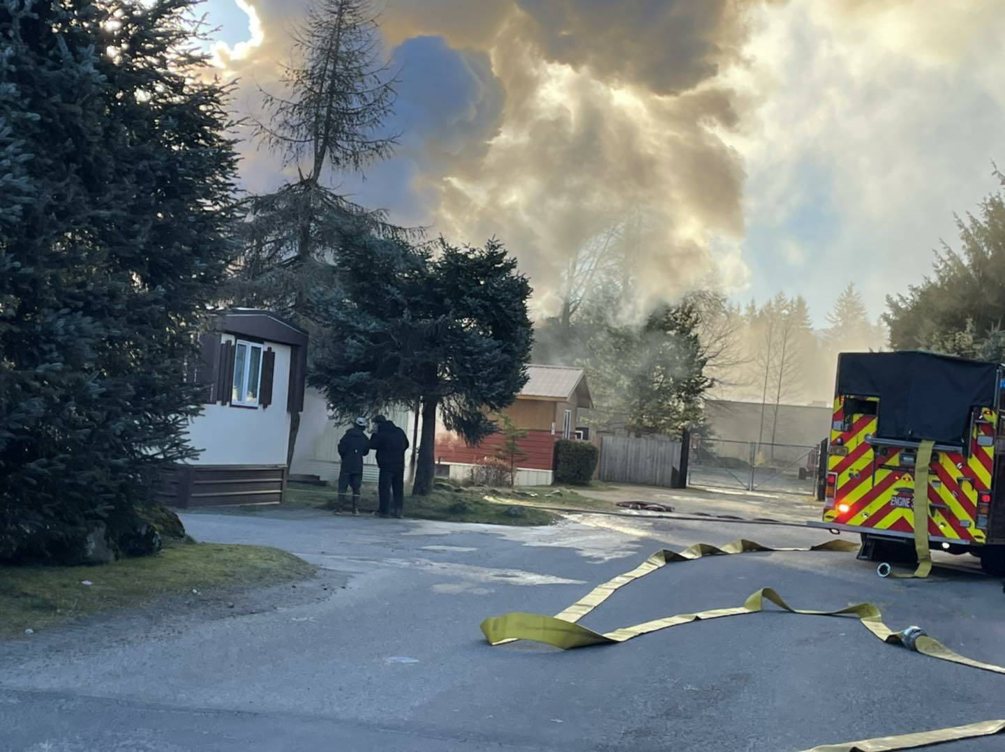CCFR firefighters working to extinguish a fire at a mobile home in Sprucewood Park on Monday morning. One man was reported to have escaped the fire with minor injuries and was taken to Bartlett Regional Hospital. (Courtesy Photo / CCFR)