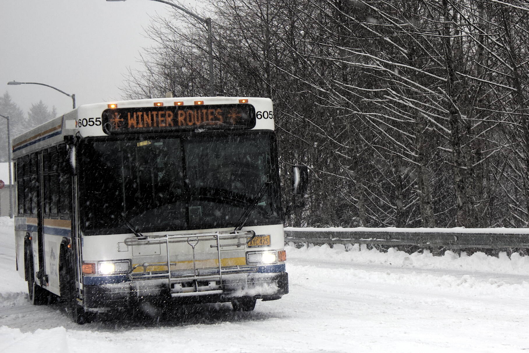 Mark Sabbatini / Juneau Empire 
A Capital Transit bus advises riders winter routes are in effect Thursday as the first heavy snowfall of the season limits service to some difficult-to-access streets.