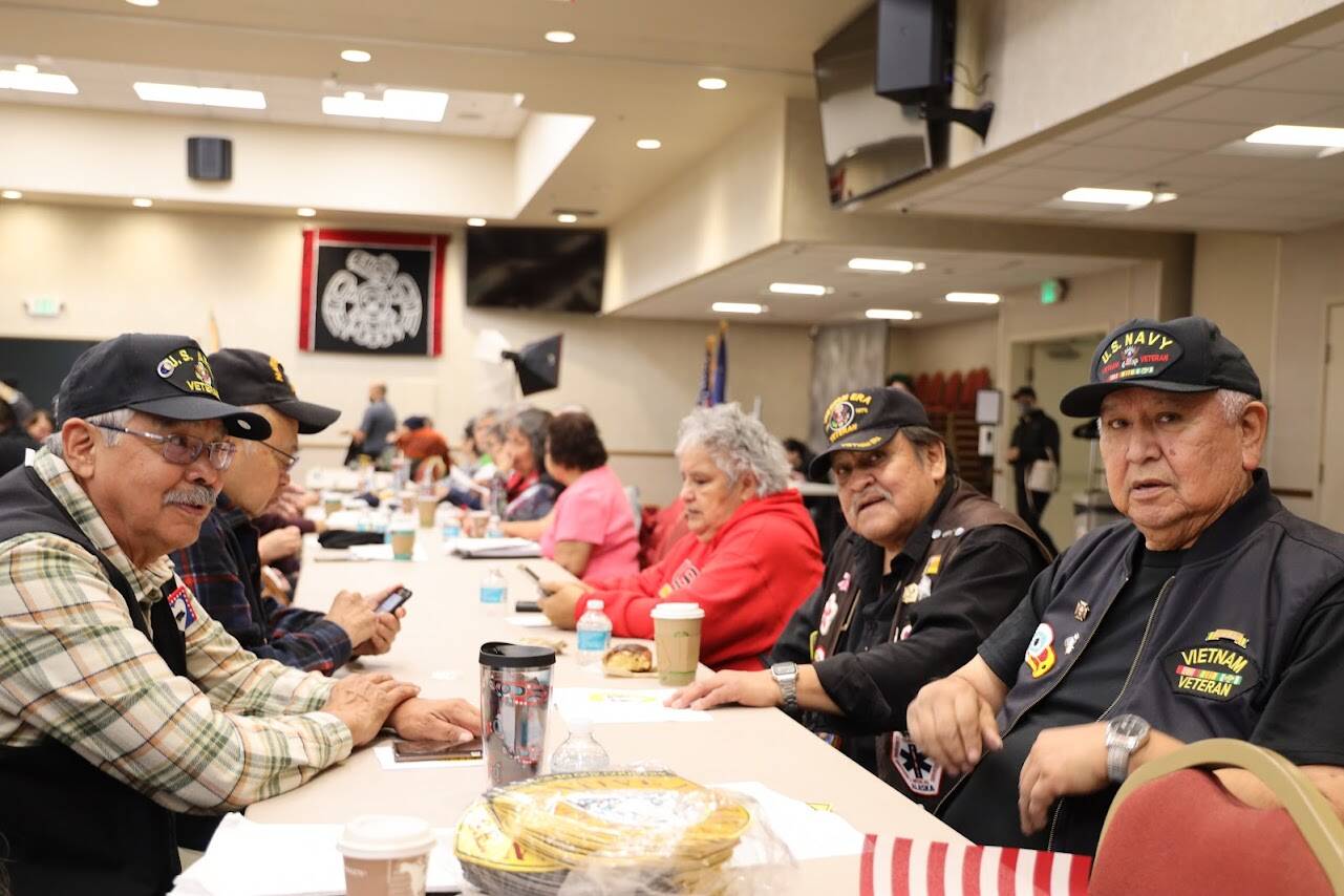 Roger Sheakley and Frank Lee, Vietnam War veterans from Hoonah, sit at a table together along with other Alaska Native veterans Friday afternoon at the Elizabeth Peratrovich Hall for an annual Veterans Day ceremony and luncheon hosted by the Southeast Alaska Native Veterans. (Clarise Larson / Juneau Empire)