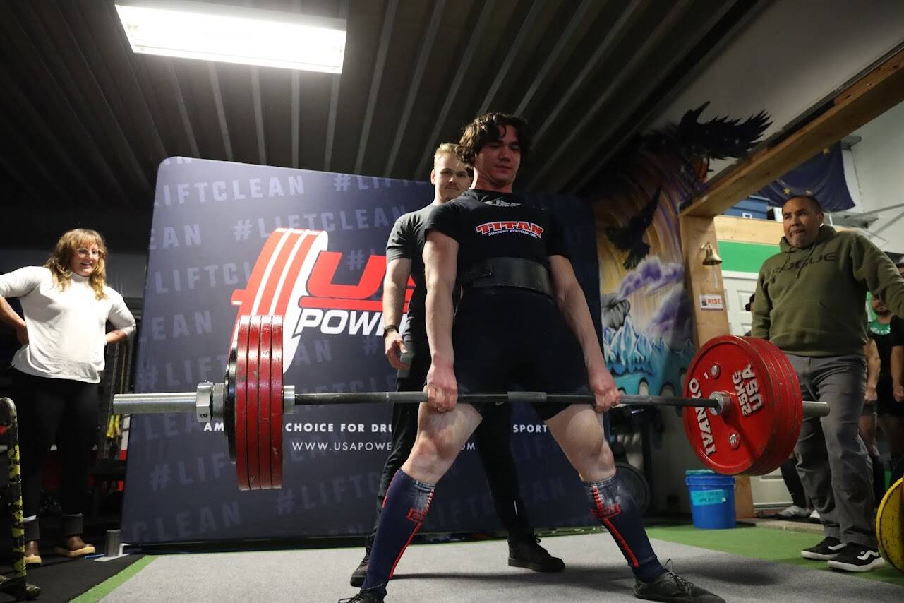 A competitor successfully completes a deadlift during the USA Powerlifting Coastal Clash competition Monday afternoon. (Clarise Larson / Juneau Empire)