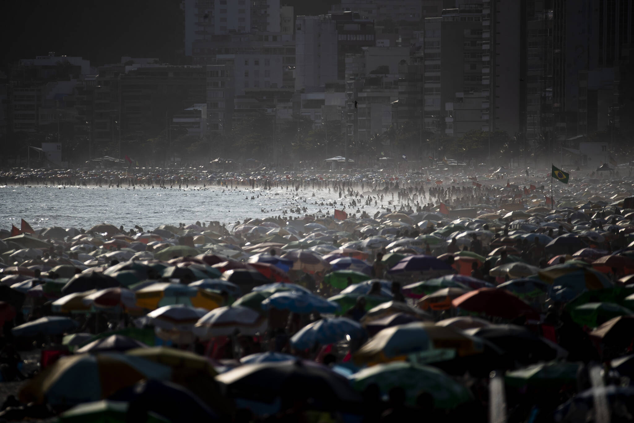 People enjoy the Ipanema beach, in Rio de Janeiro, Brazil, Sunday, Nov.13, 2022. The worlds population is projected to hit an estimated 8 billion people on Tuesday, Nov. 15, according to a United Nations projection. (AP Photo / Bruna Prado)