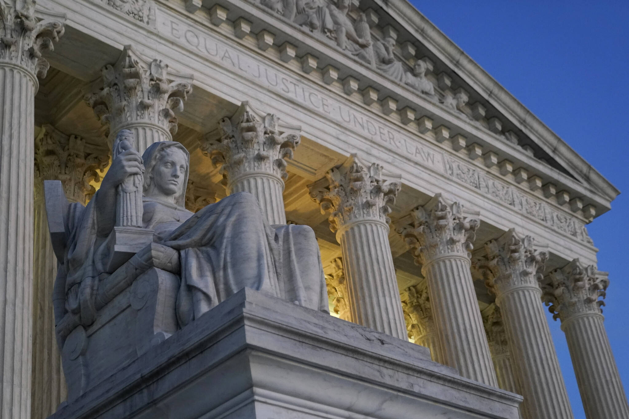 Light illuminates part of the Supreme Court building on Capitol Hill in Washington, Wednesday, Nov. 16, 2022. The Biden administration plans to ask the Supreme Court to reinstate the presidents student debt cancellation plan, according to a Thursday legal filing warning that Americans will face financial strain if the plan remains stalled in court when loan payments are scheduled to restart in January. (AP Photo / Patrick Semansky)