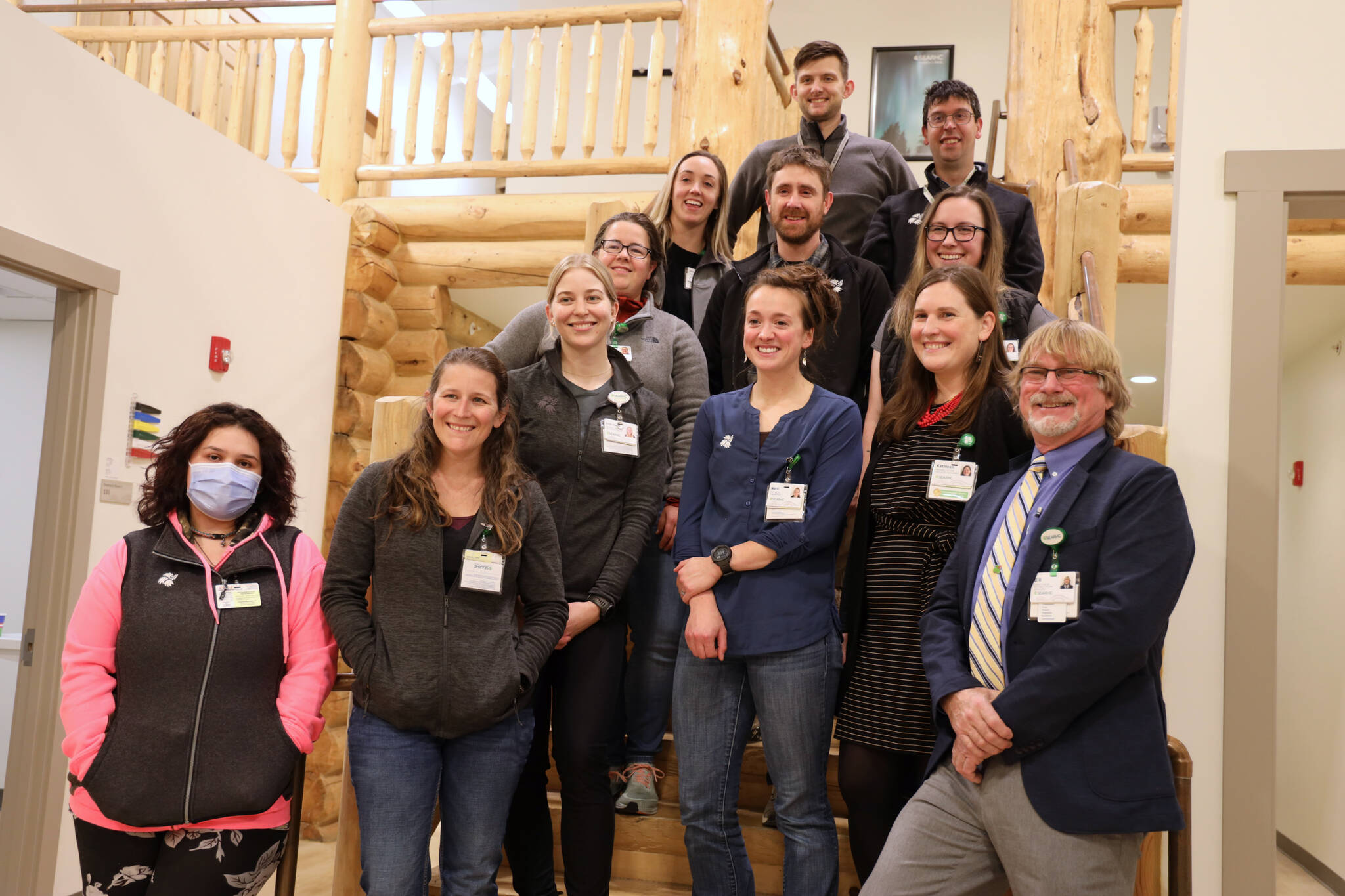 Staff pose for a picture at the new SouthEast Alaska Regional Health Consortium physical rehabilitation clinic in the Mendenhall Valley. (Clarise Larson / Juneau Empire)
