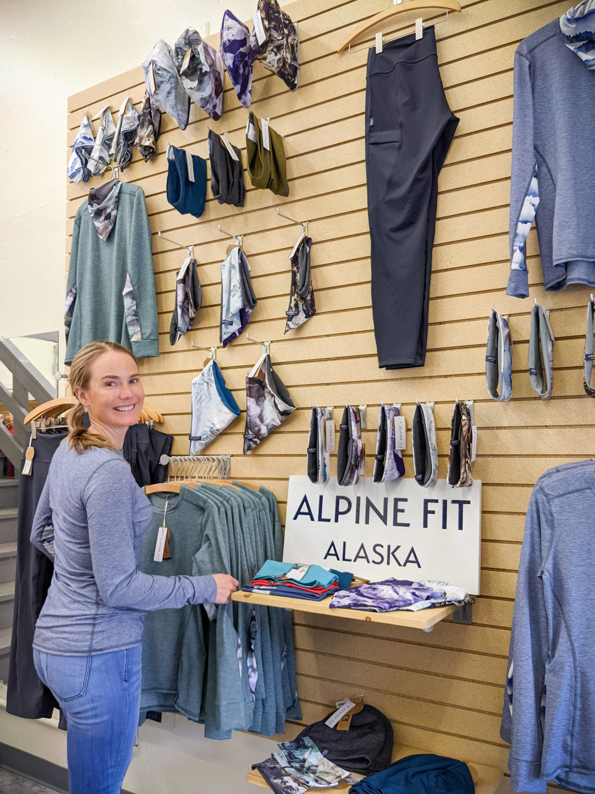 Courtesy Photo / Jennifer Loofbourrow 
Jen Loofbourrow setting up a display of Alpine Fit base layers and bushwhacking leggings at her manufacturing space in Anchorage. Loofbourrow will be one of 55 new vendors featured at this year’s Juneau Public Market.