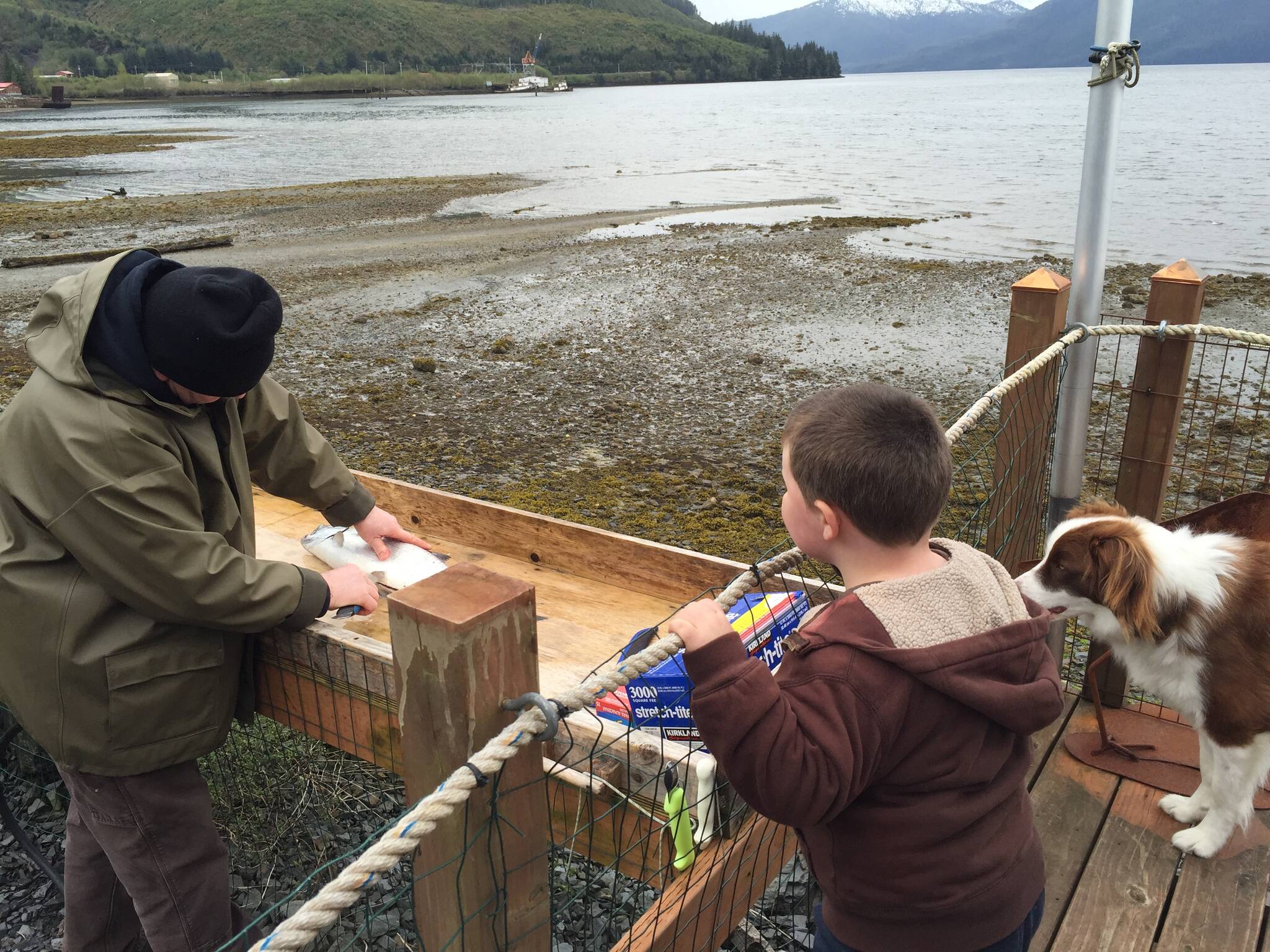 Jonah Hurst learns how to clean salmon. Wrangell, Alaska. (Courtesy Photo / Vivian Faith Prescott)