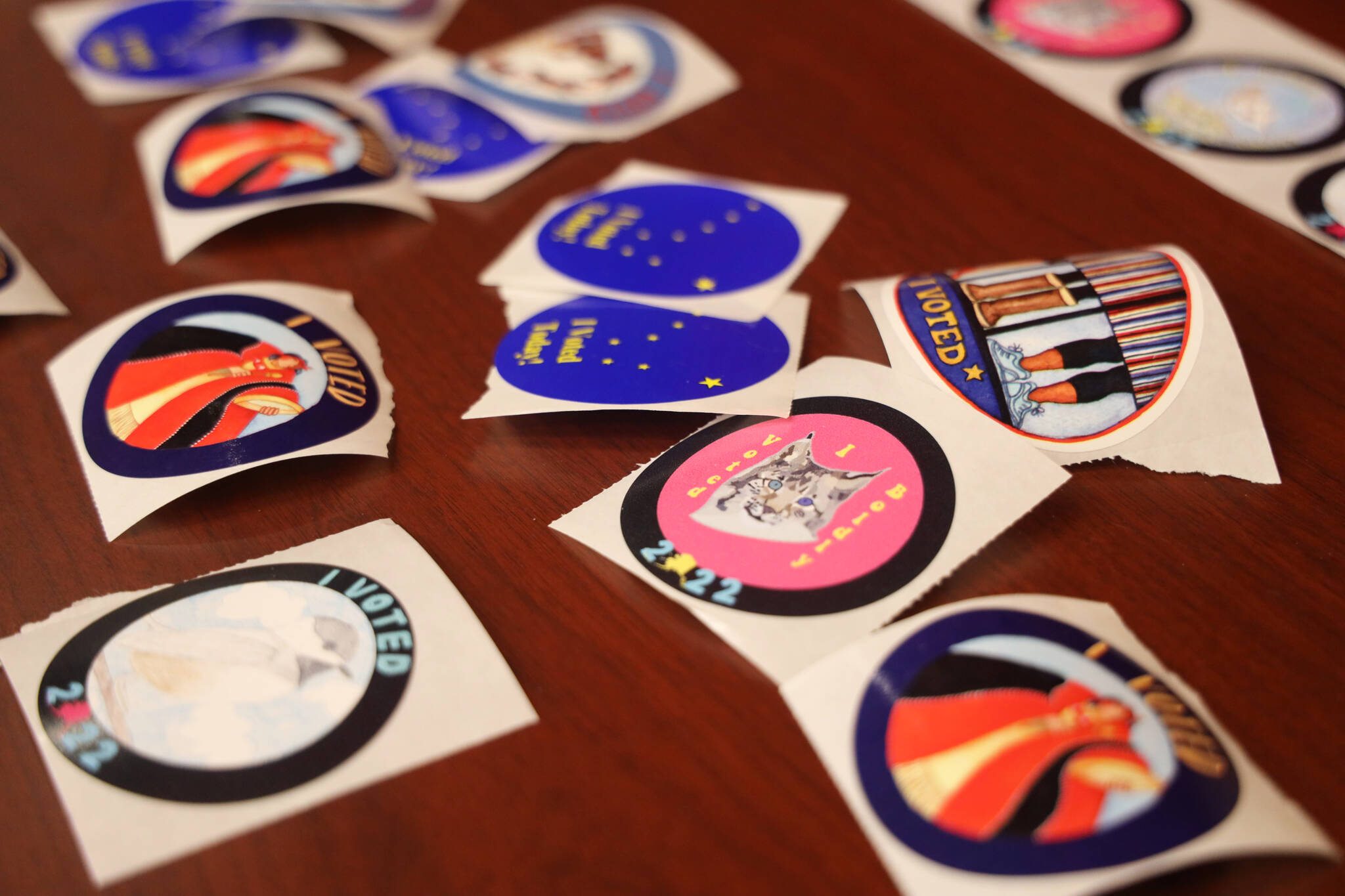 An array of stickers awaits voters on Election Day 2022. With votes tallied and certified, the Empire reviewed how Juneau and nearby communities voted precinct by precinct. (Clarise Larson / Juneau Empire File)