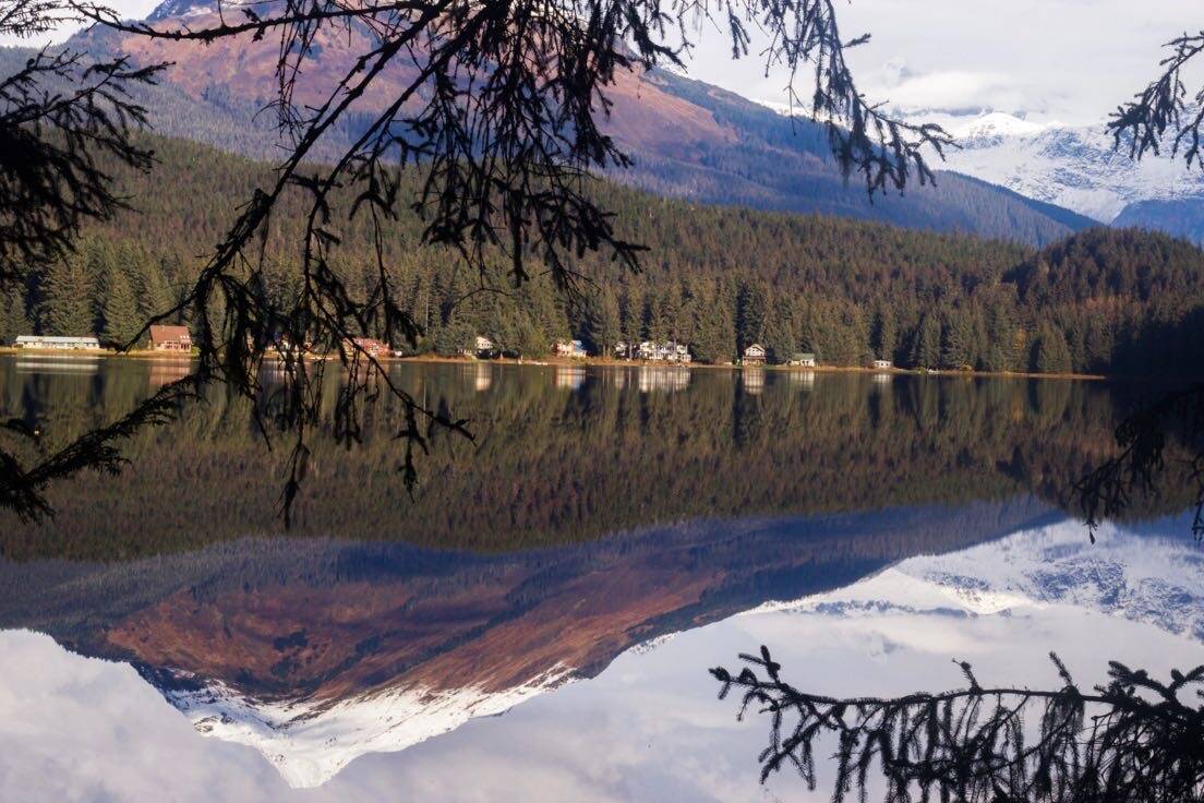 This photo shows a mountain scene reflected in the waters of Auke Lake. (Courtesy Photo / Felina N. Villarreal)