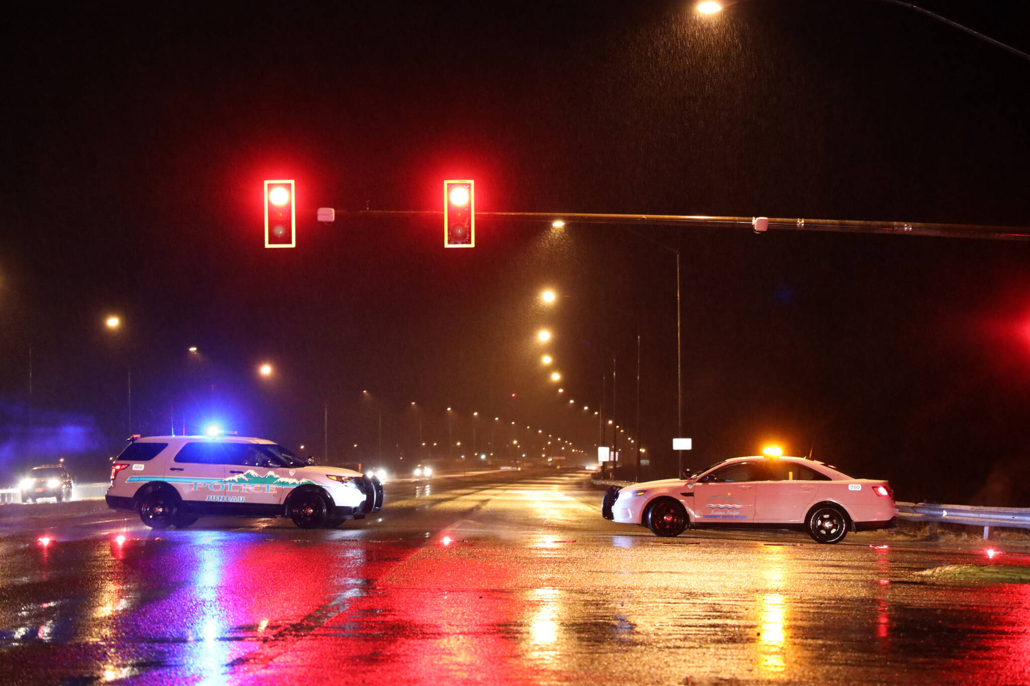 Police vehicles block Egan Drive going toward the Mendenhall Valley after a multi-vehicle wreck Wednesday evening. (Clarise Larson / Juneau Empire)