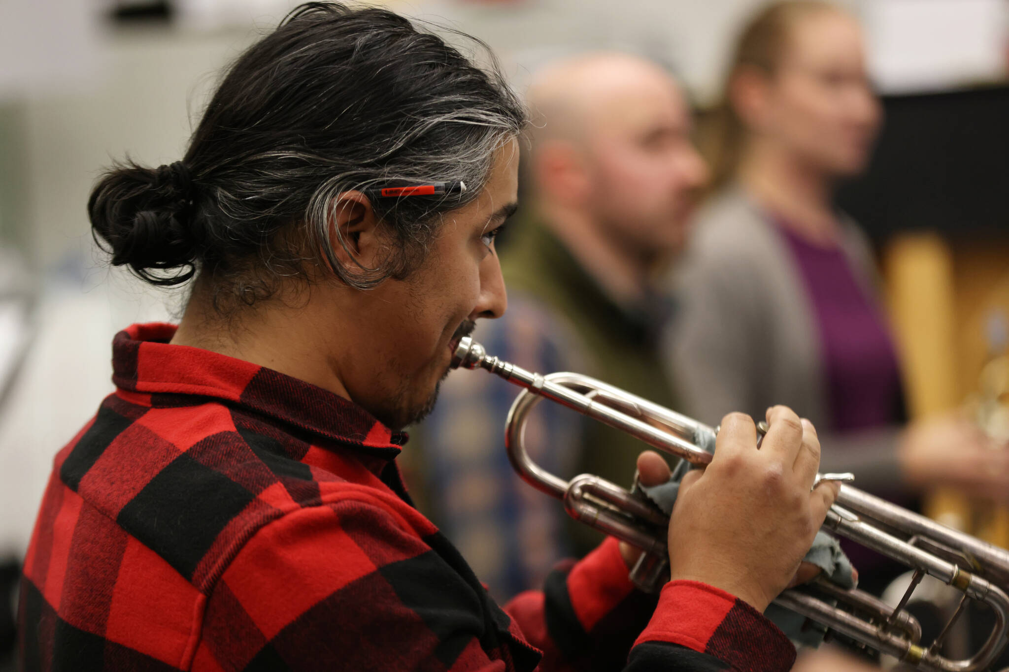Luis Cardenas Casillas, a member of the Sitka Fine Arts Camp Holiday Brass, rehearses with the Juneau Symphony for the upcoming Holiday Cheer concert. (Ben Hohenstatt / Juneau Empire)