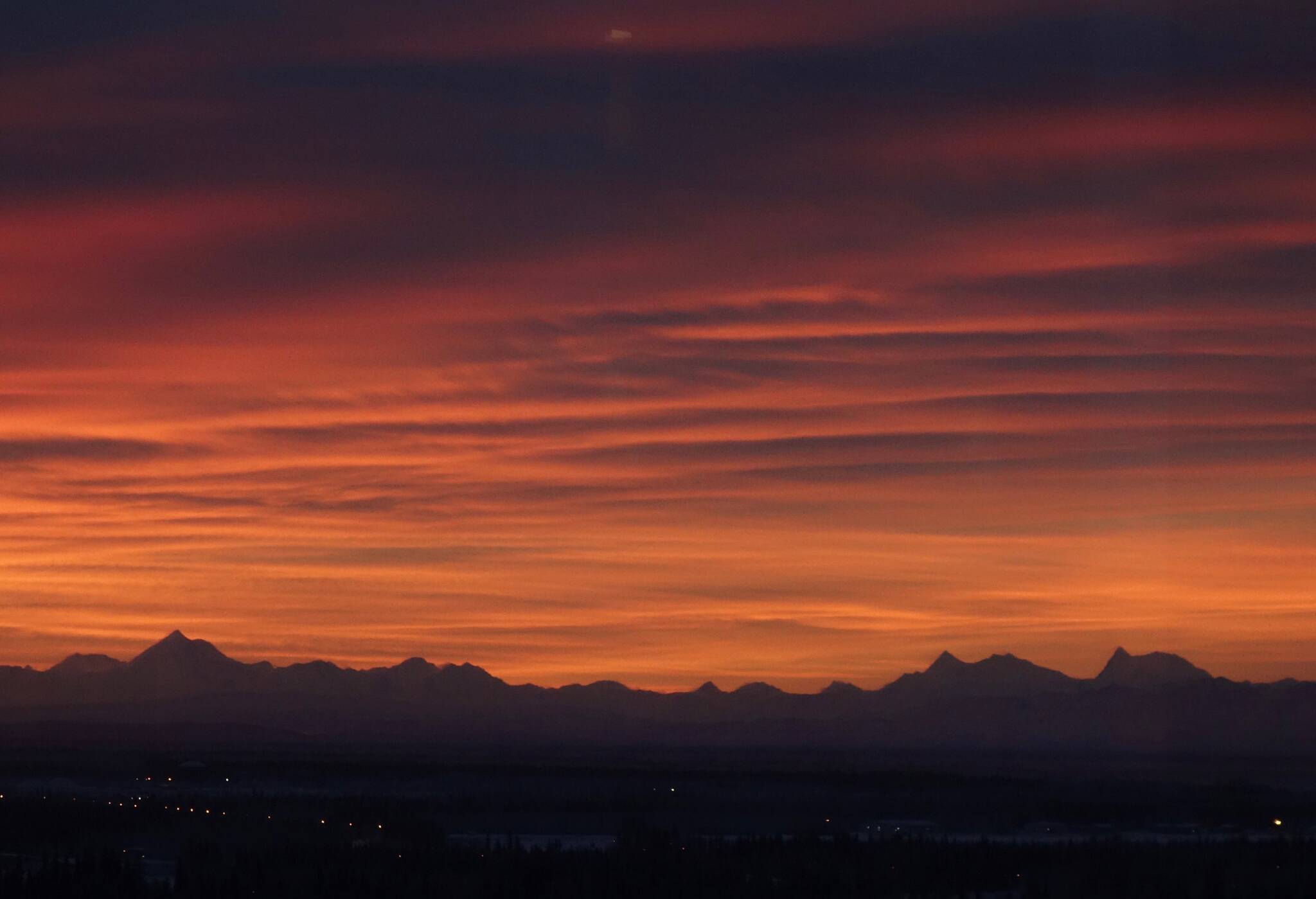 he Alaska Range sits beneath a December sunrise as seen from the UAF campus. (Courtesy Photo / Ned Rozell)