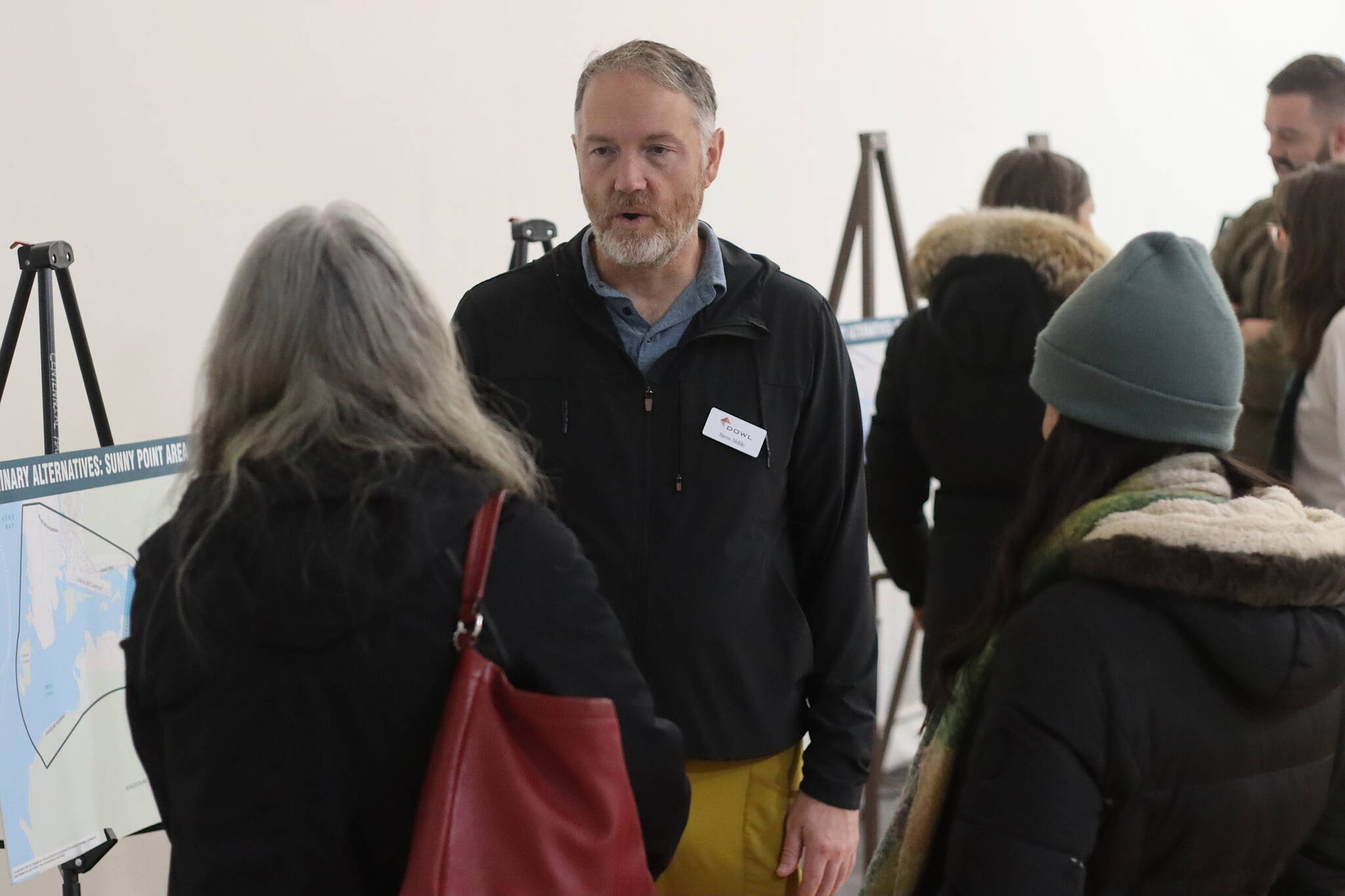 Steve Noble, senior project manager for Dowl, discusses new options for a second Douglas crossing during an open house as part of the evaluation process Monday at the Juneau Arts Humanities Council building. (Mark Sabbatini / Juneau Empire)