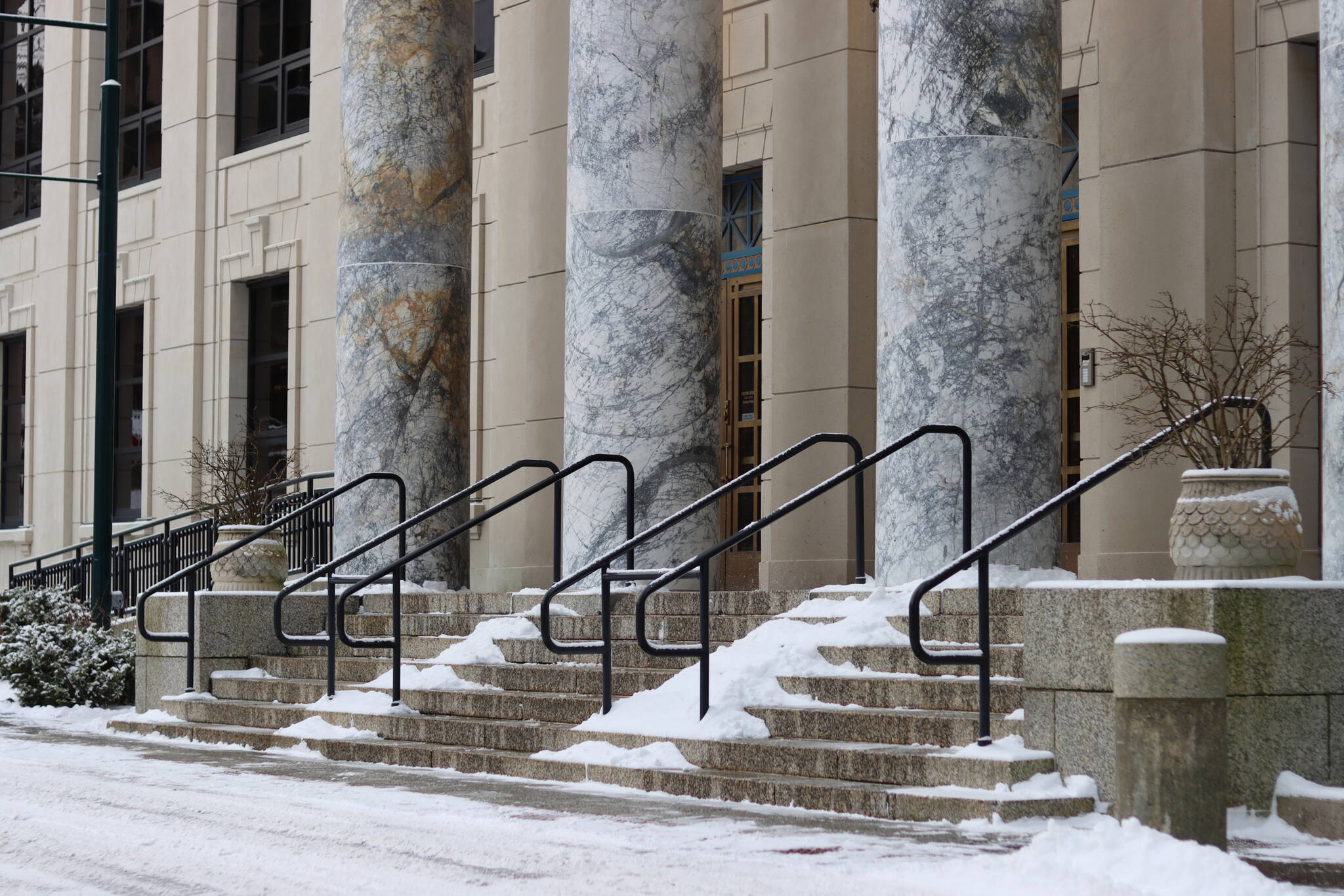 This photo shows the snowy steps of the Alaska State Capitol. (Jonson Kuhn / Juneau Empire File)