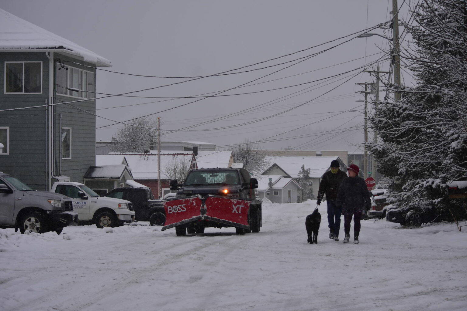 Juneau residents the streets in Douglas during a winter storm in December of 2021. (Peter Segall / Juneau Empire File)