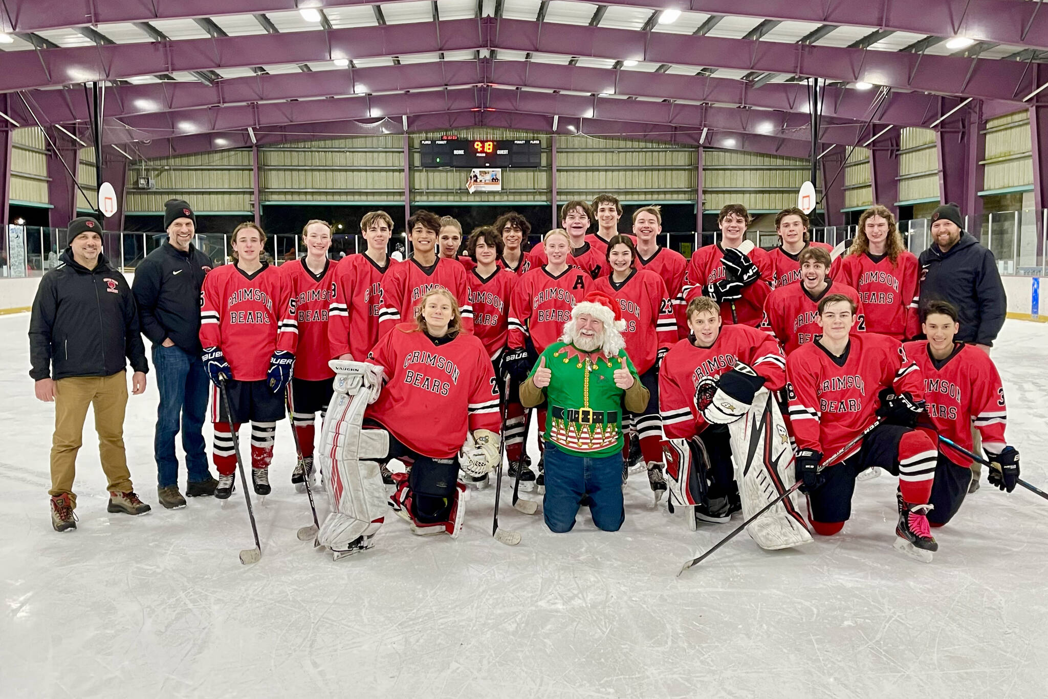 Courtesy / Judy Campbell 
The Juneau-Douglas High School: Yadaa.at Kalé Crimson Bears Varsity hockey team poses with Santa after sleighing the competition during the team’s weekend stint in Kodiak.