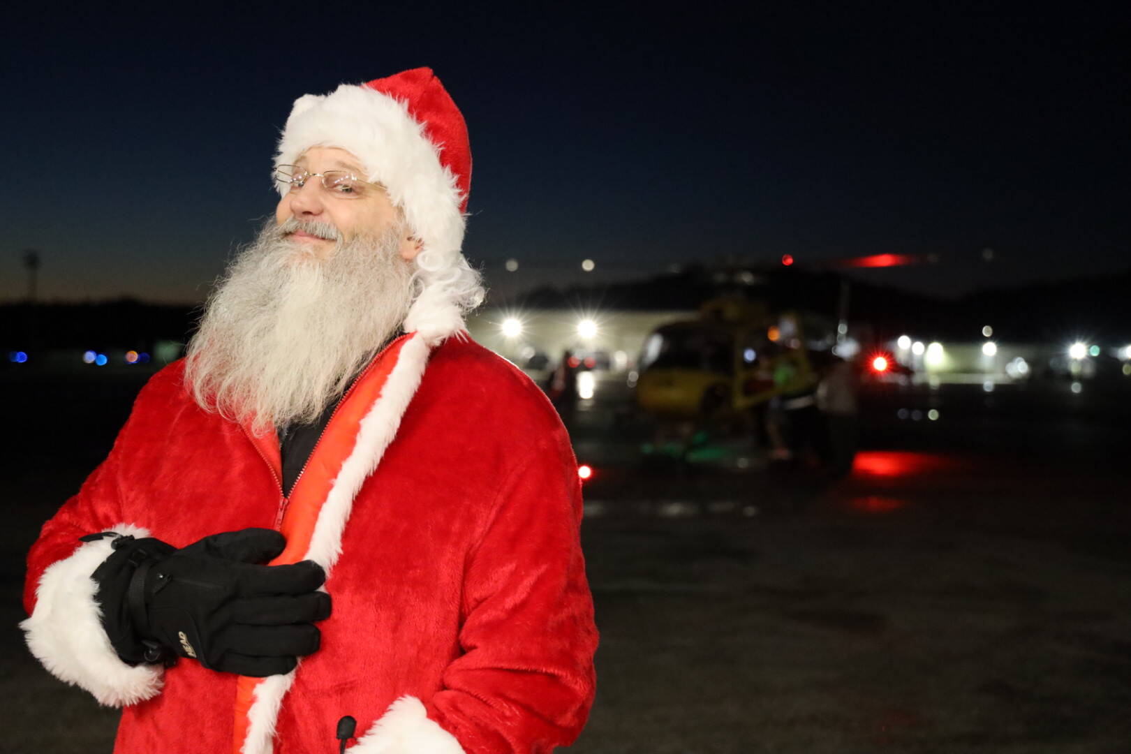 Clarise Larson / Juneau Empire
Santa poses after exiting a helicopter at Juneau International Airport. He reported no reindeer sightings en route to the airport for Christmas Light Flights.