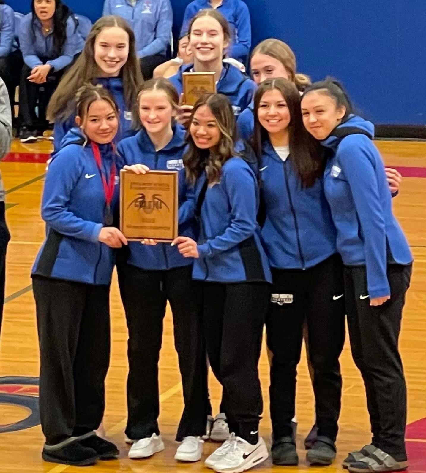 The Thunder Mountain High School girls basketball team poses for a photo with a plaque after winning the Sitka Coastal Holiday Classic tournament. (Courtesy Photo)