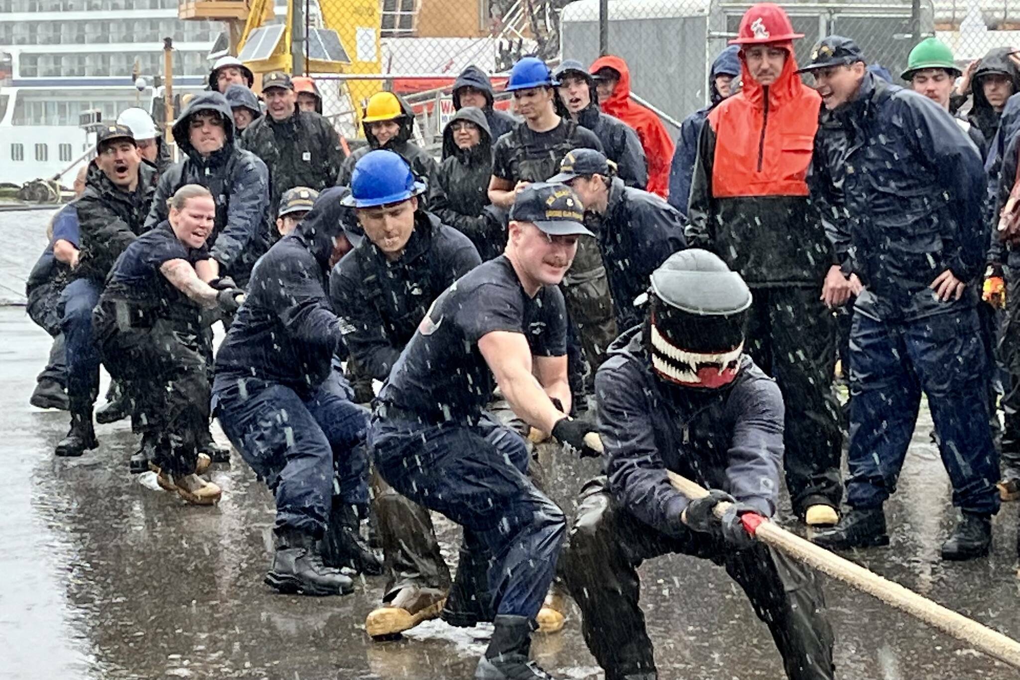 Team Elm faces off against Team Cypress in a tug of war battle in heavy rain during the U.S. Coast Guard’s annual Buoy Tender Olympics on Aug. 17 at the Coast Guard Station Juneau. (Jonson Kuhn / Juneau Empire)
