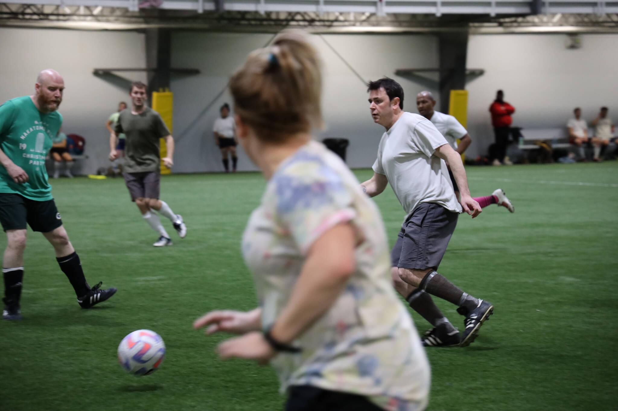 Ann Hoke await a pass from her teammate, Mickey Kenny, during a soccer match Monday evening at the Dimond Park Field House a part of the Holiday Cup soccer tournament. (Clarise Larson / Juneau Empire)
