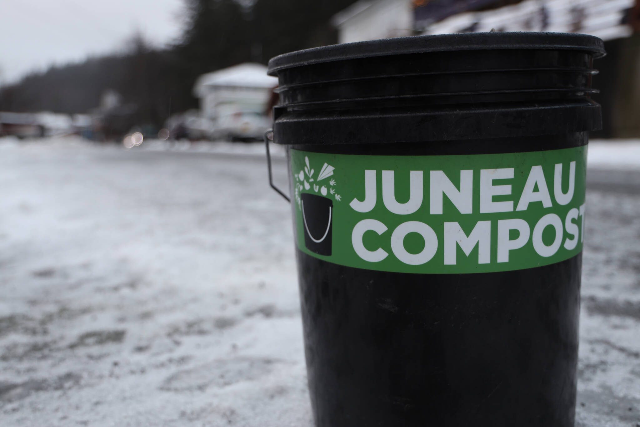 A bucket of compost awaits pickup by Juneau Composts on Douglas Tuesday morning. The City and Borough of Juneau was earmarked to be included in the $1.7 trillion spending bill which would allocate $2.5 million in funding toward designing and constructing a commercial-scale compost facility in Juneau. (Clarise Larson / Juneau Empire)