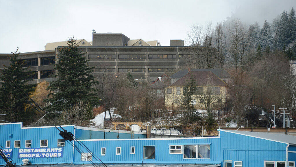 Juneau's Telephone Hill neighborhood is seen at center right, beneath the State Office Building, on Wednesday, Dec. 28, 2022. The neighborhood, owned by the state of Alaska, is being transferred to the City and Borough of Juneau. (James Brooks / Alaska Beacon)